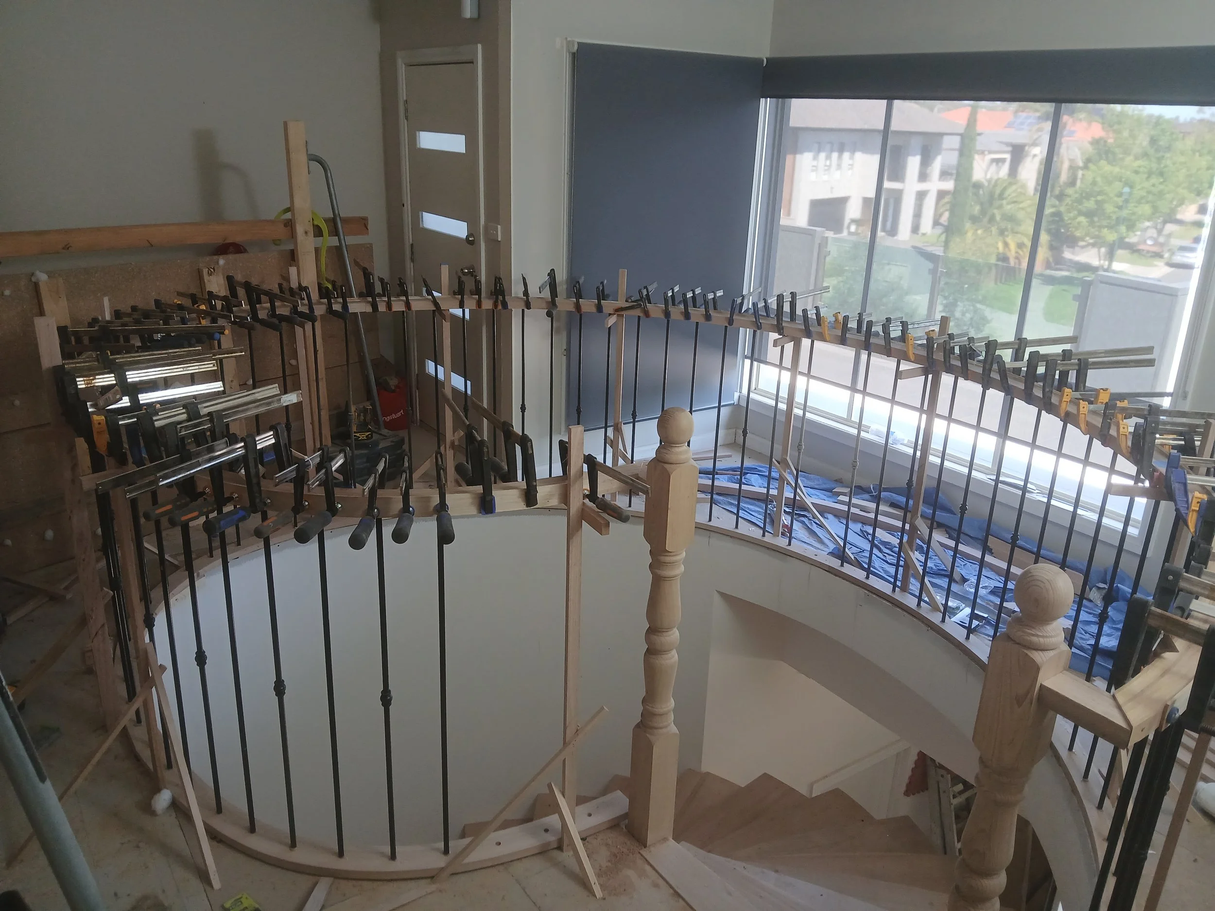 laminating curved handrail on site 2.jpg