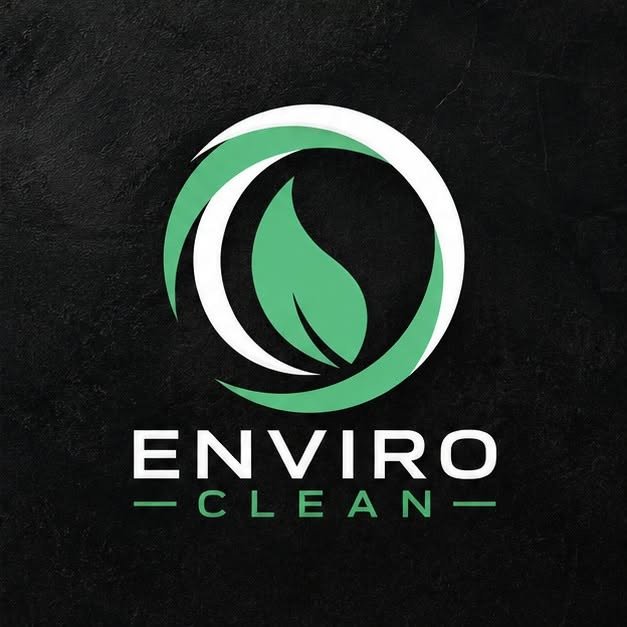 A logo with a green leaf inside a circular design, with the words 'ENVIRO CLEAN' underneath, on a black background.