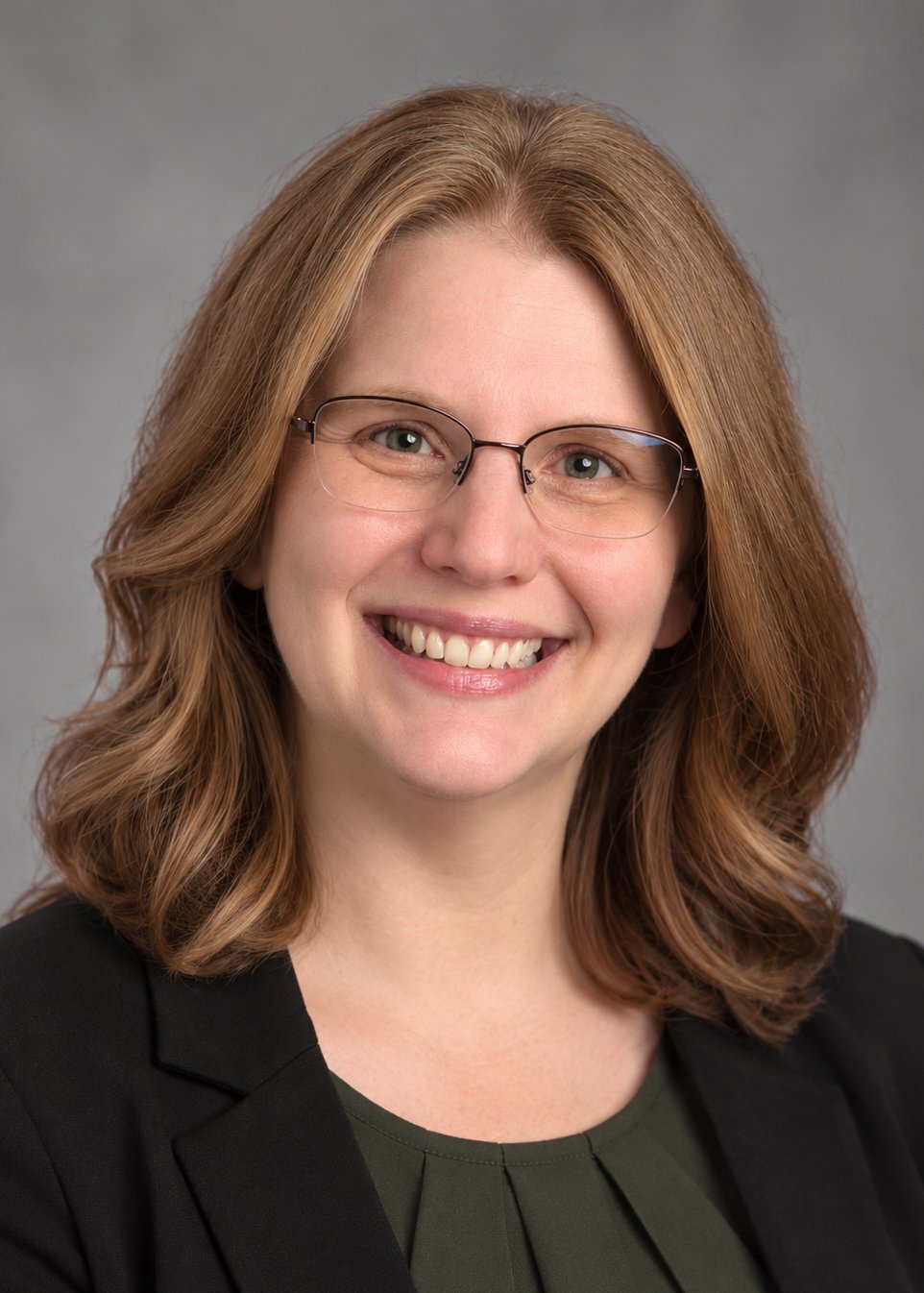 A photograph of Nicole Mueller, owner of Socially Started.