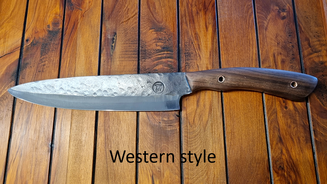 A Western style knife with a textured metal blade and wooden handle positioned on a wooden surface.