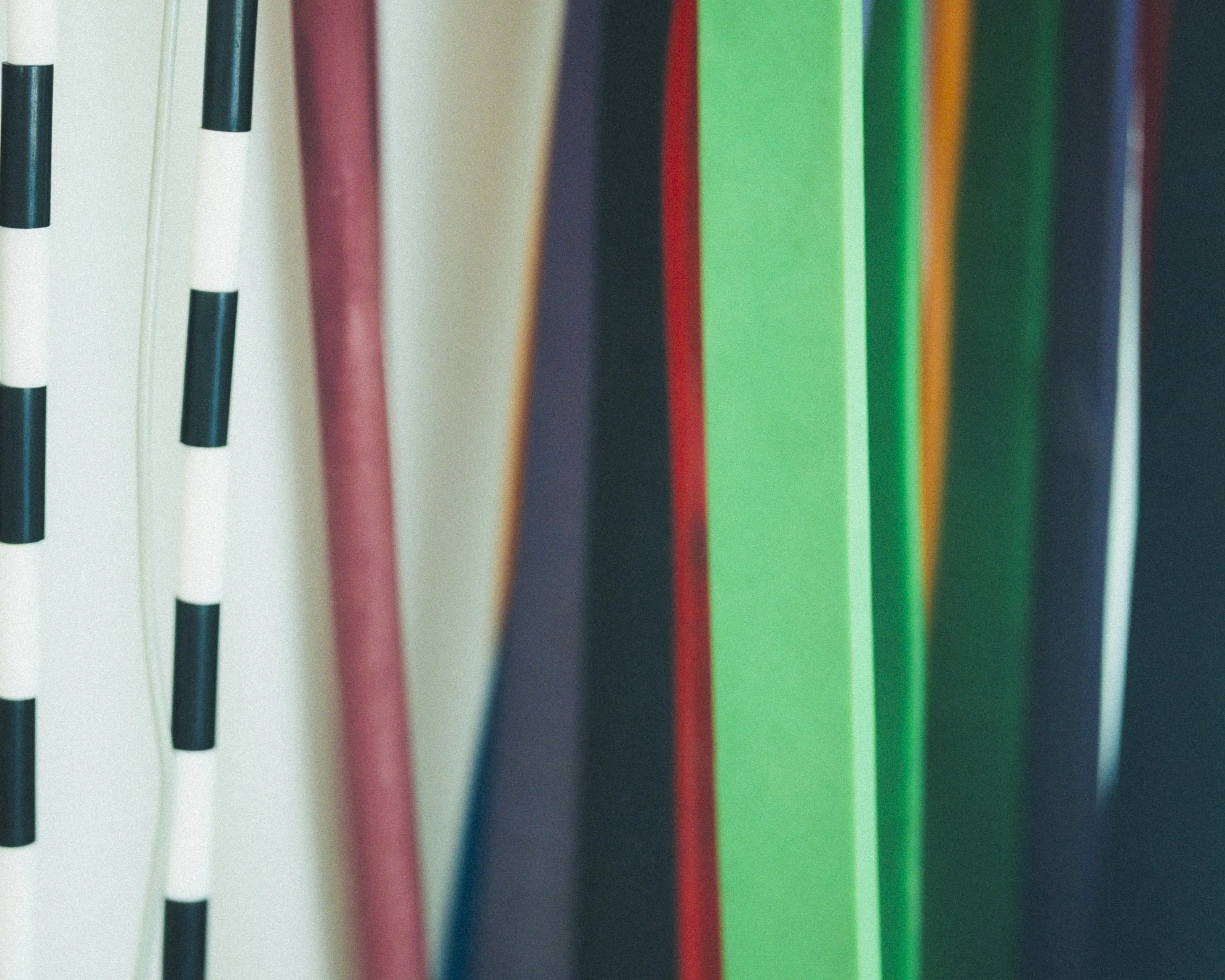 Close-up of colored pencils standing upright in a row.