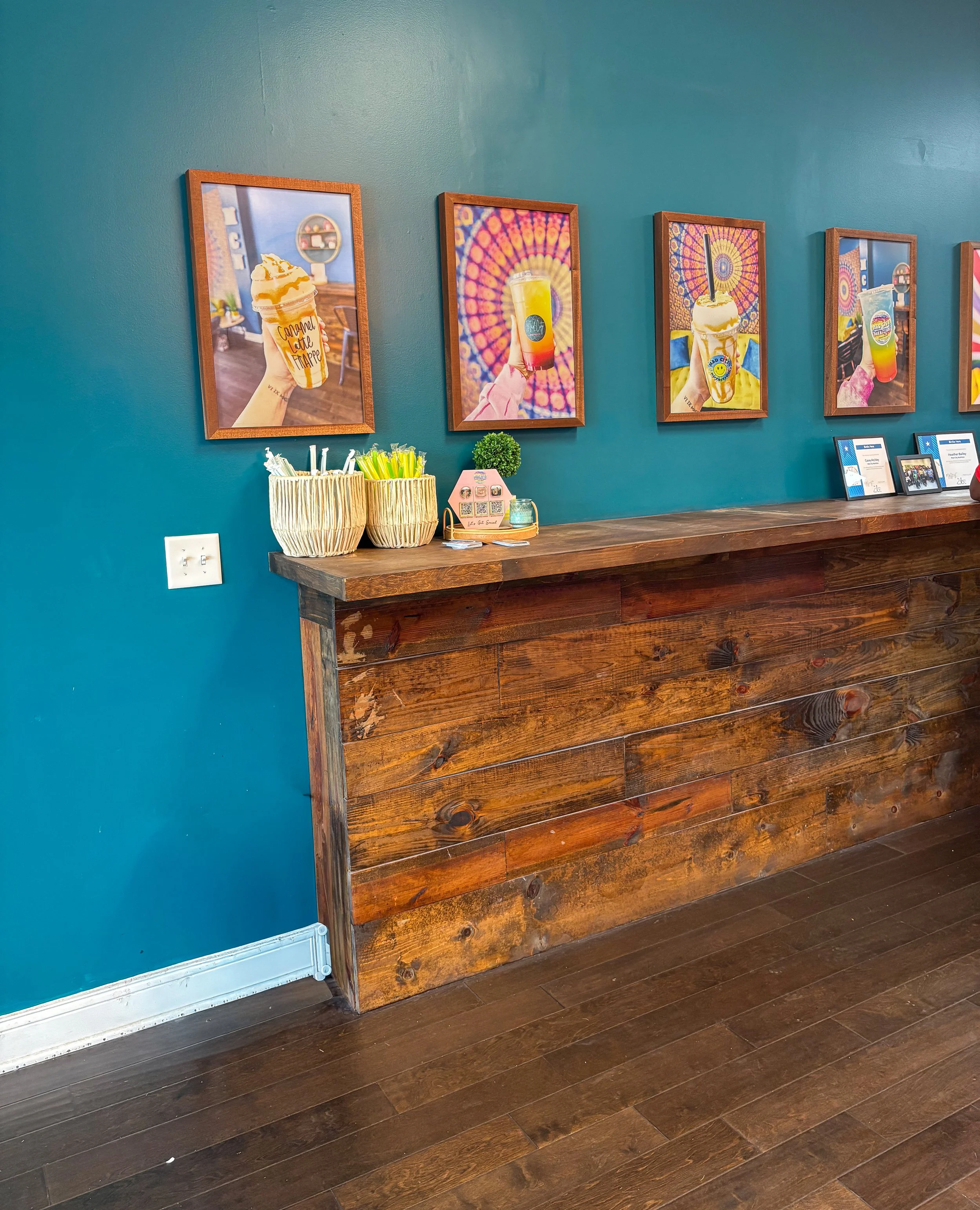 Wood counter + framed drink photography
