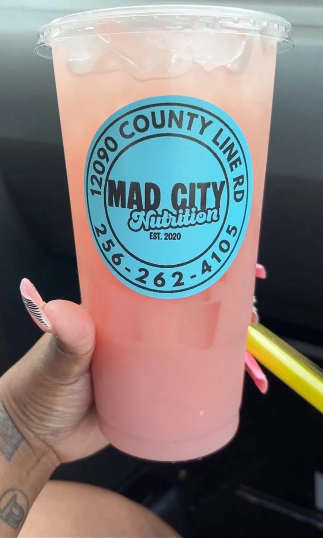 Pink Panther drink with probiotics and strawberry lemonade flavored collagen in hand