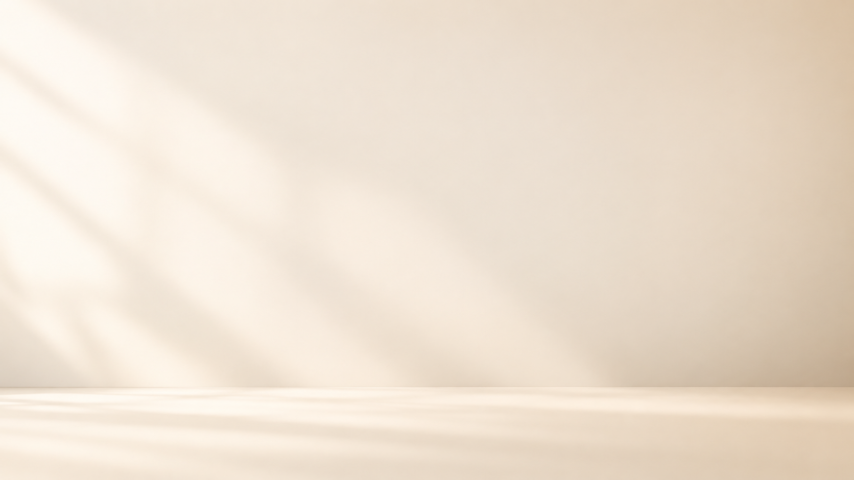 Empty white space with faint shadows on the wall, a minimalistic background.