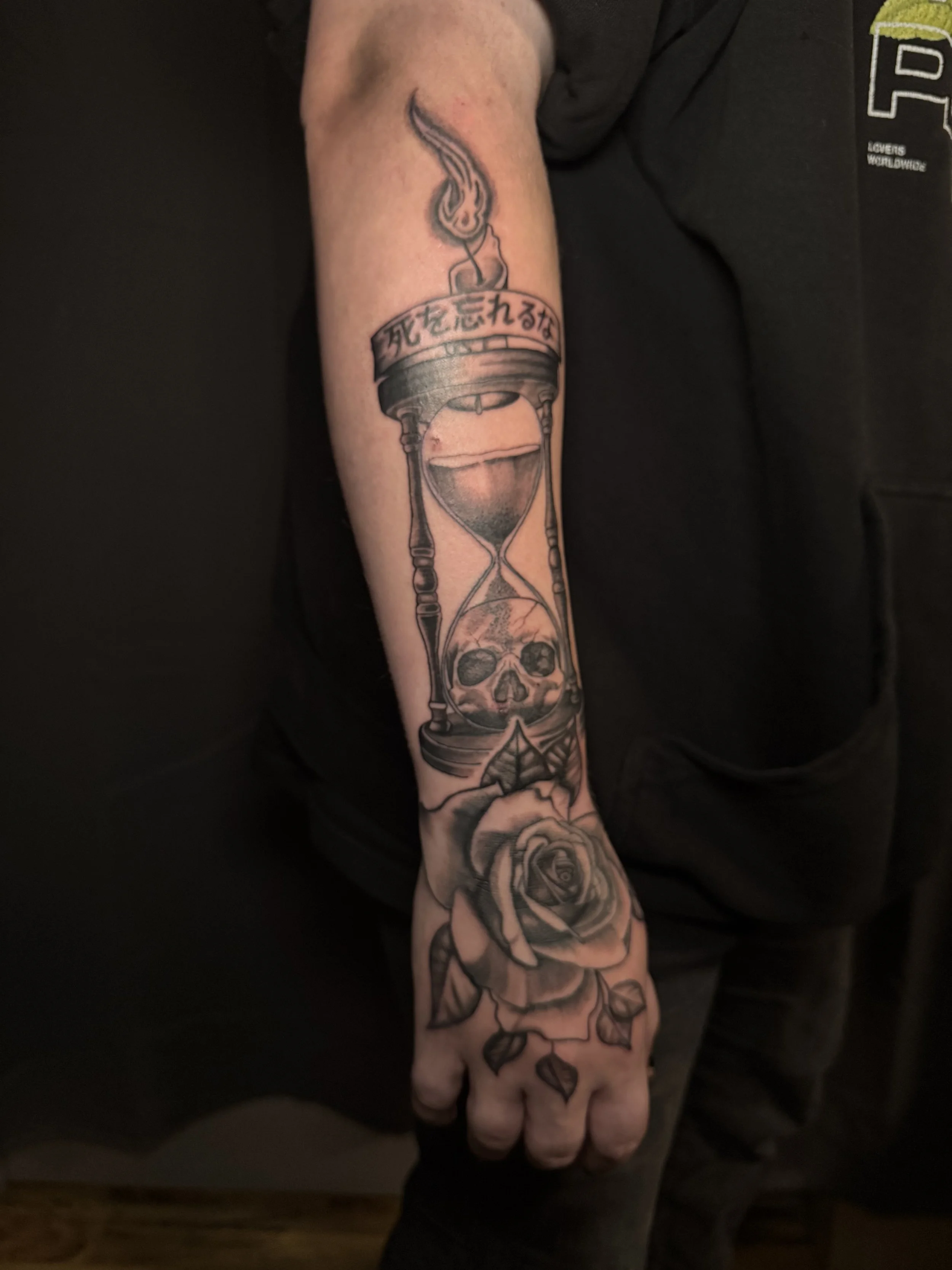 Black and grey illustrative design, hand and forearm