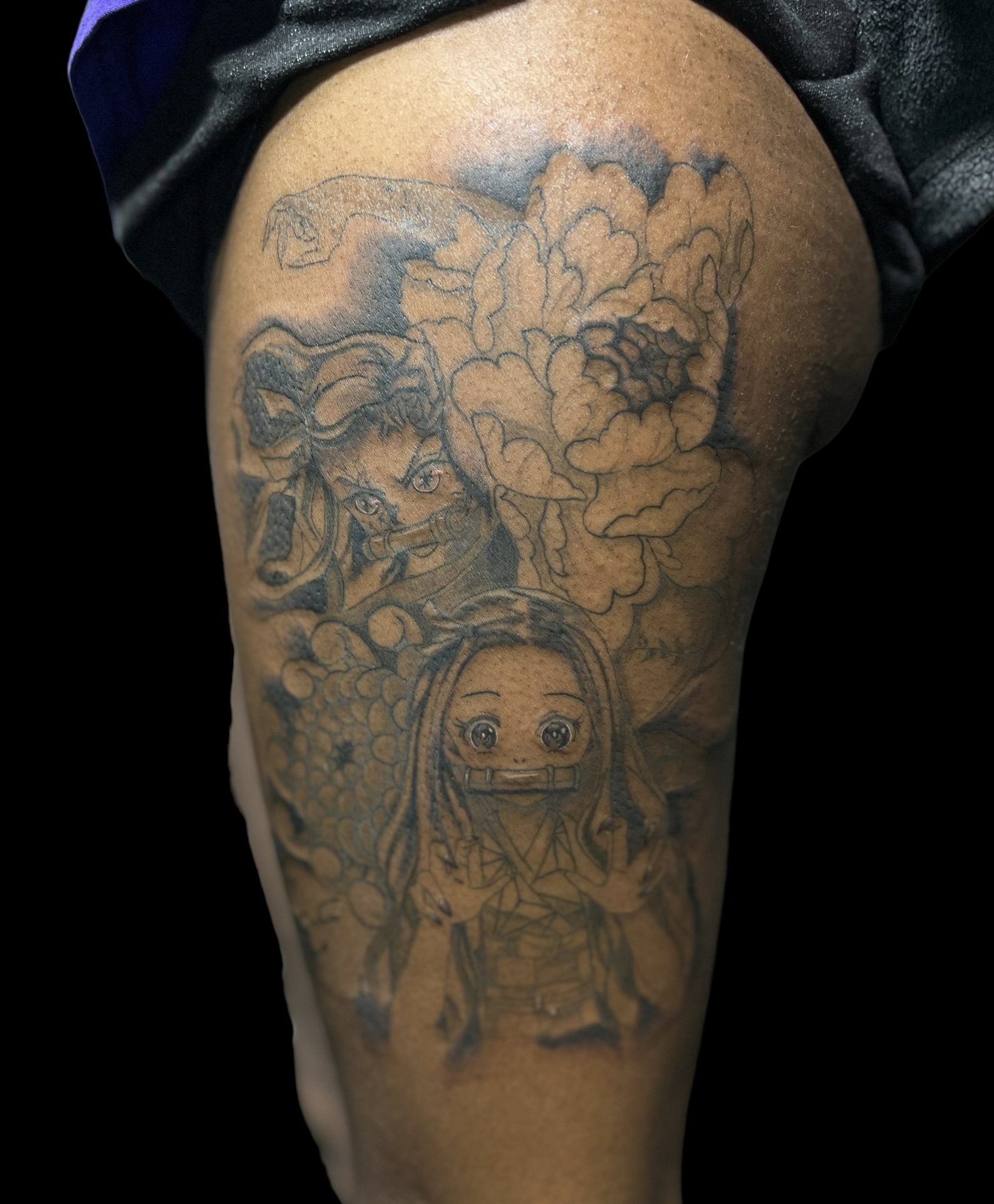 Black and grey Anime tattoo, on thigh