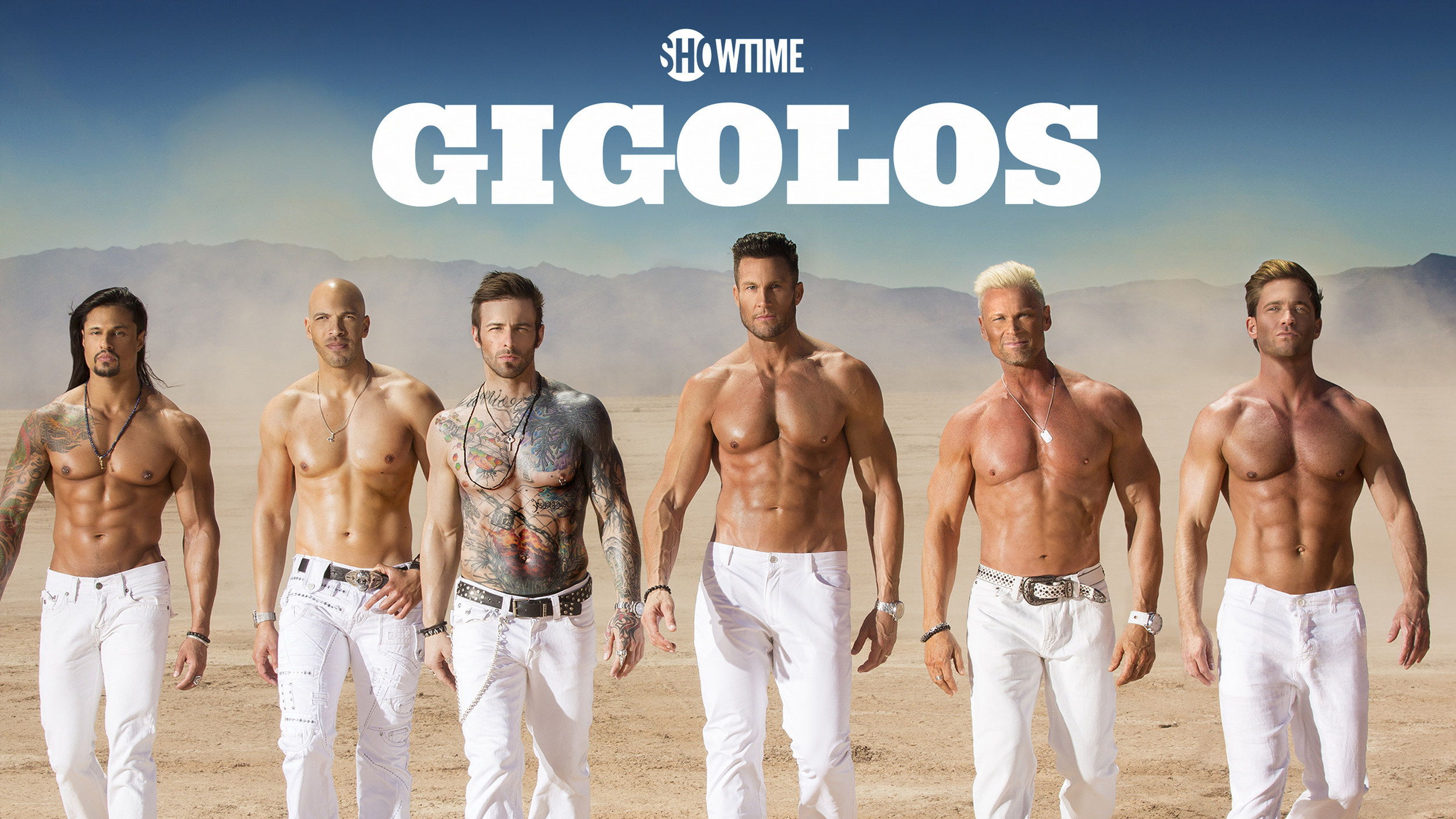 Seven shirtless men with tattoos and diverse hairstyles walking in a desert landscape with mountains in the background, with the text 'GIGolos' and 'SHOWTIME' above them.