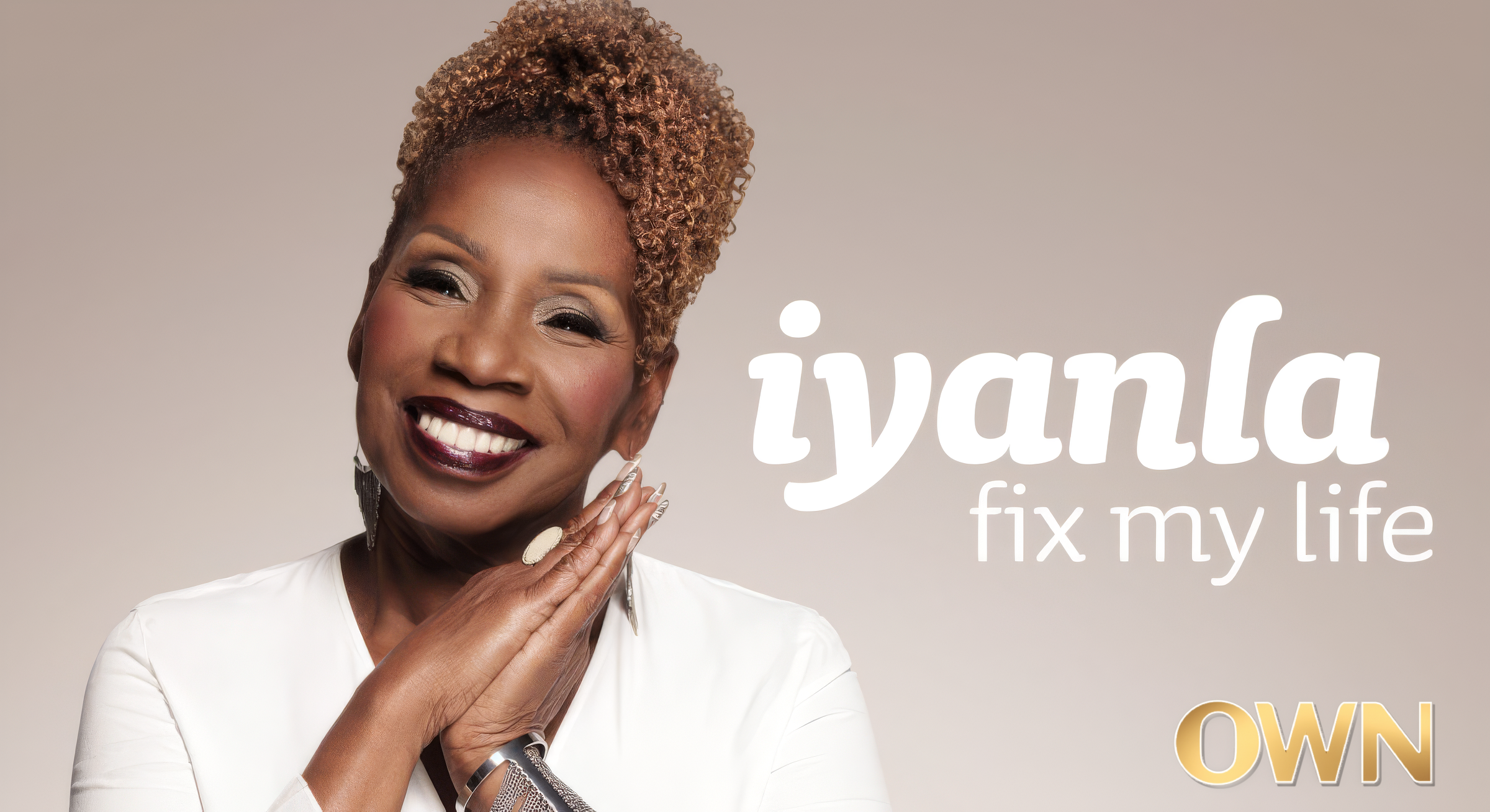 Portrait of a smiling woman with short curly hair, wearing a white blazer, with text that reads 'Jayana: fix my life' and 'OWN' in gold letters.
