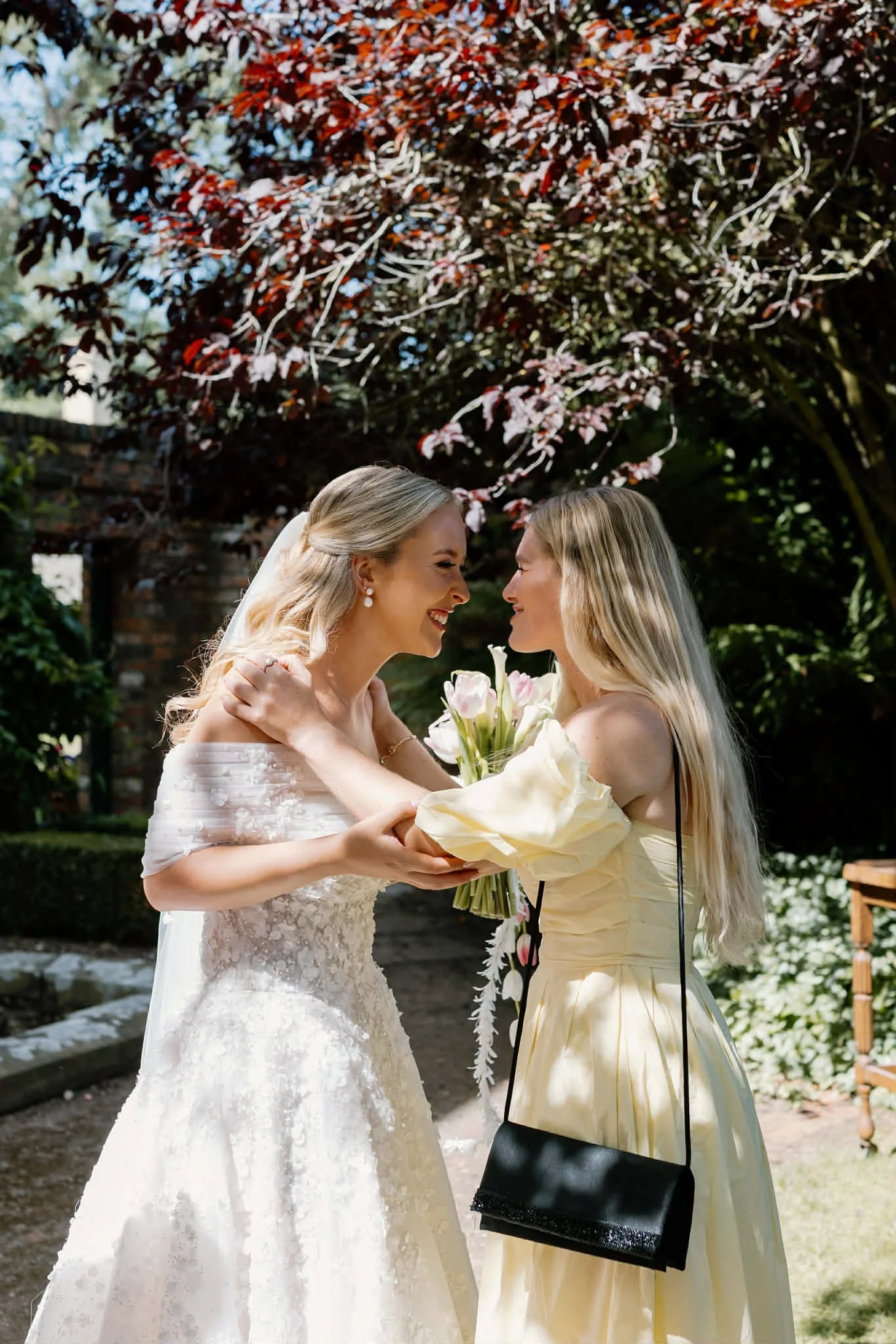 Celebrant and friend with the bride at her wedding