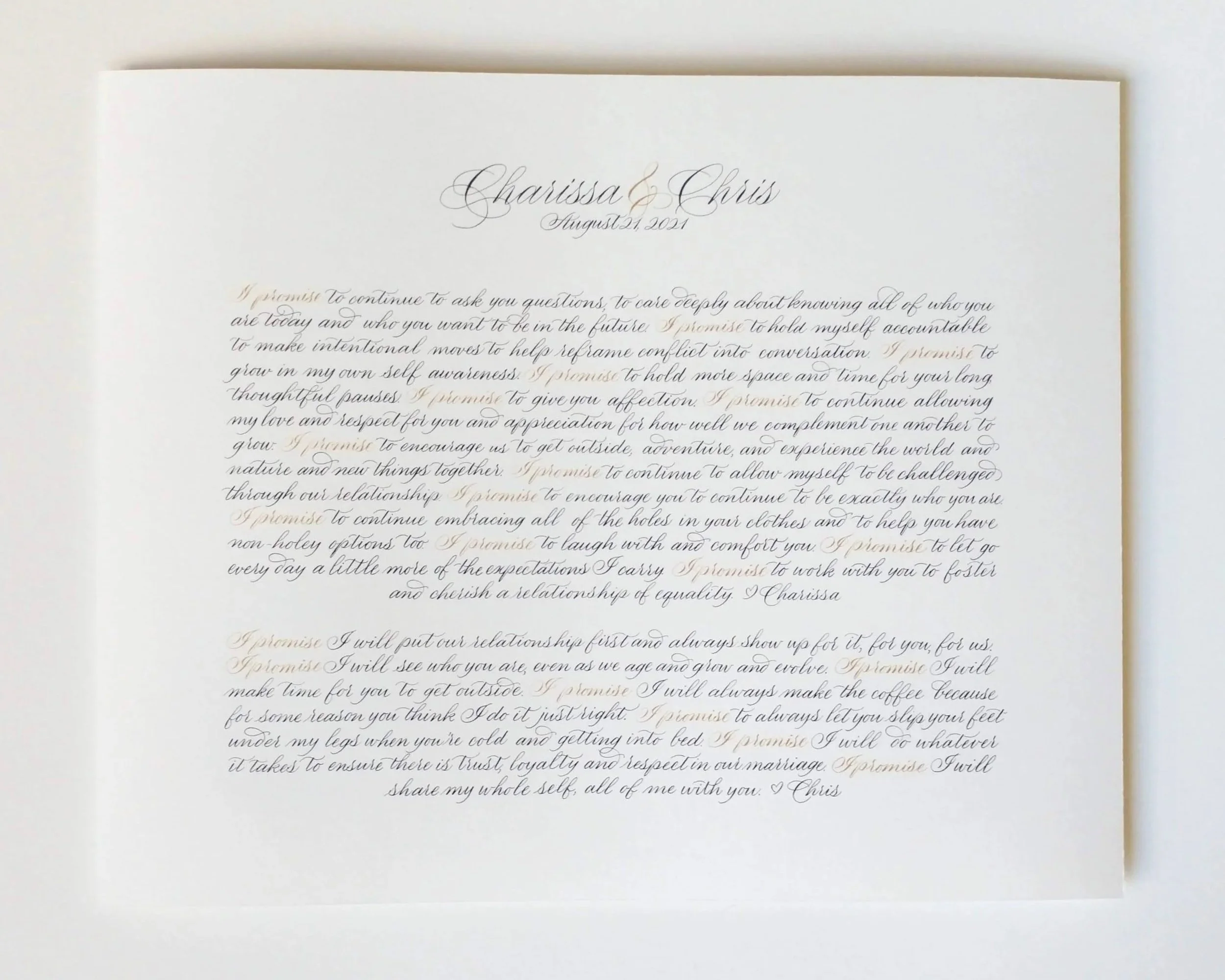 A white wedding vow booklet with elegant black cursive text, containing vows and promises exchanged between two people named Charissa and Chris on August 21, 2021.