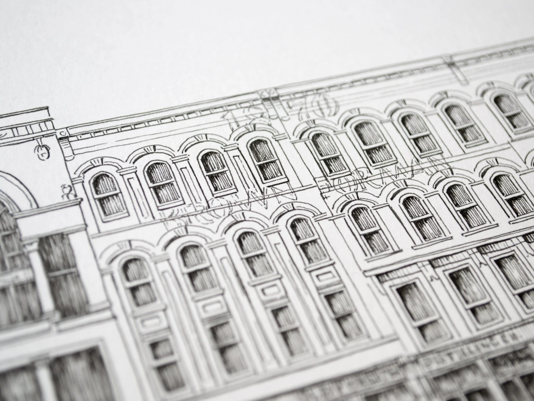 Detailed architectural drawing or blueprint of a building facade with multiple windows and decorative elements.