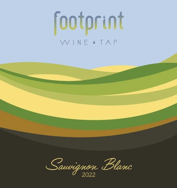Design of a wine label with stylized green hills, the words 'footprint', 'wine', 'tap', and 'Sauvignon Blanc 2022'.