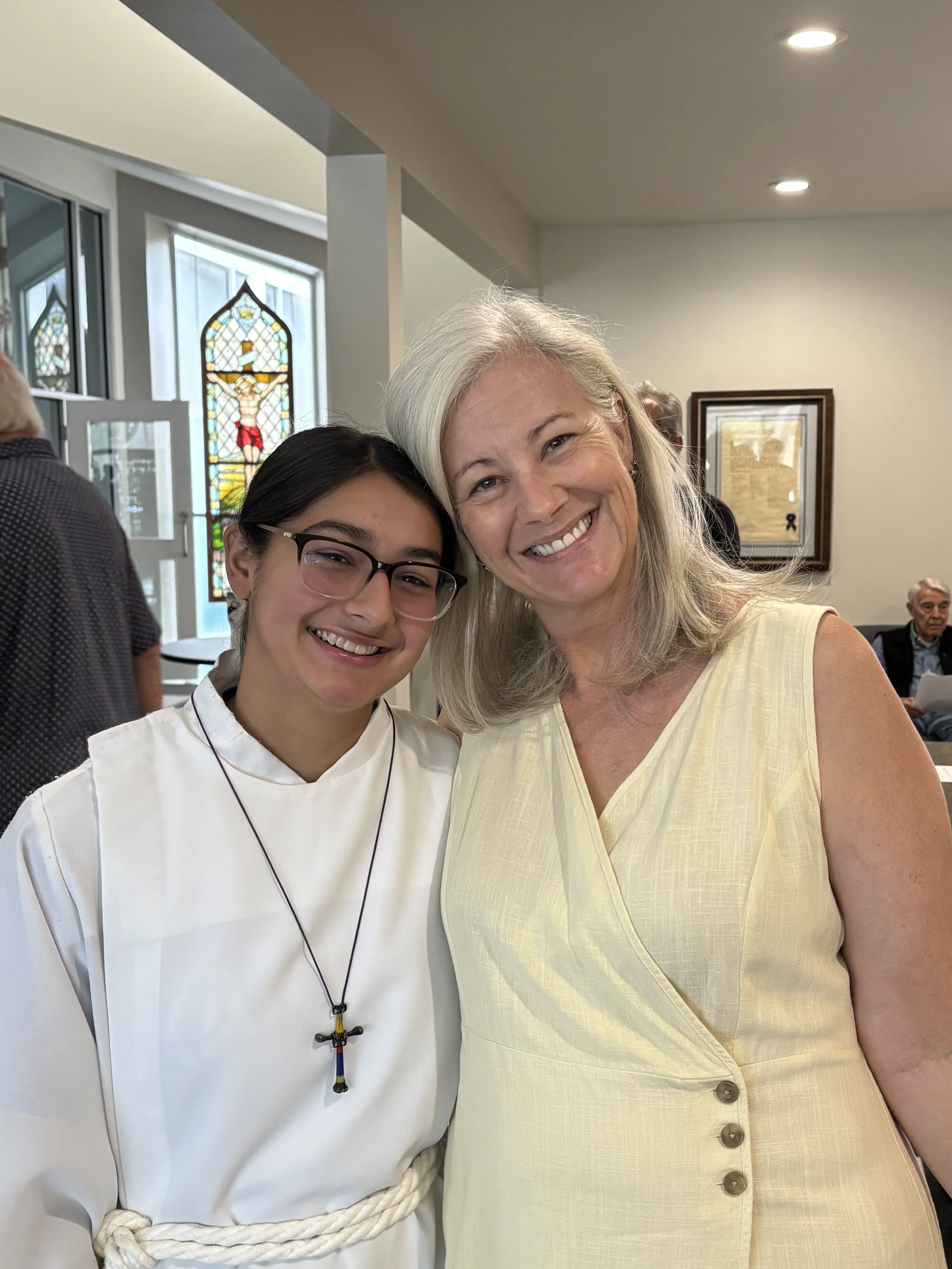 Photo of a young acolyte and a choir member