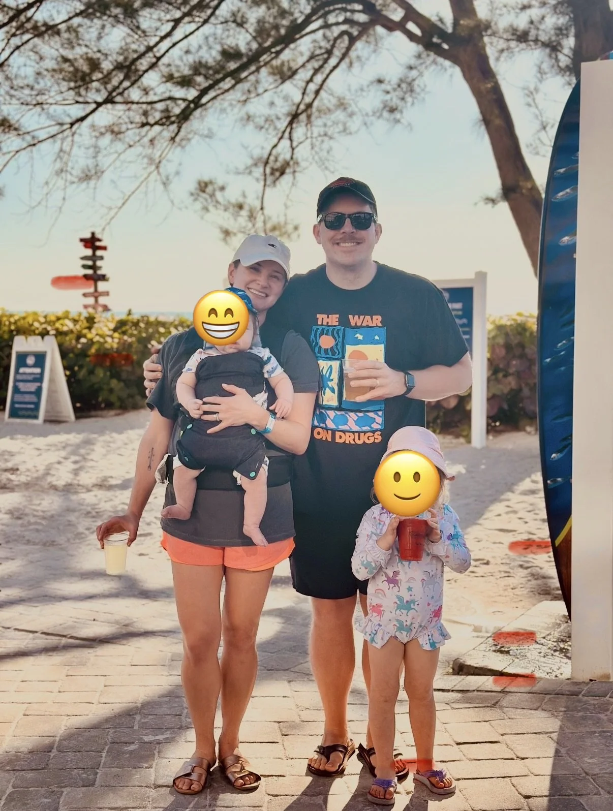 Family standing outside beachfront hotel entrance