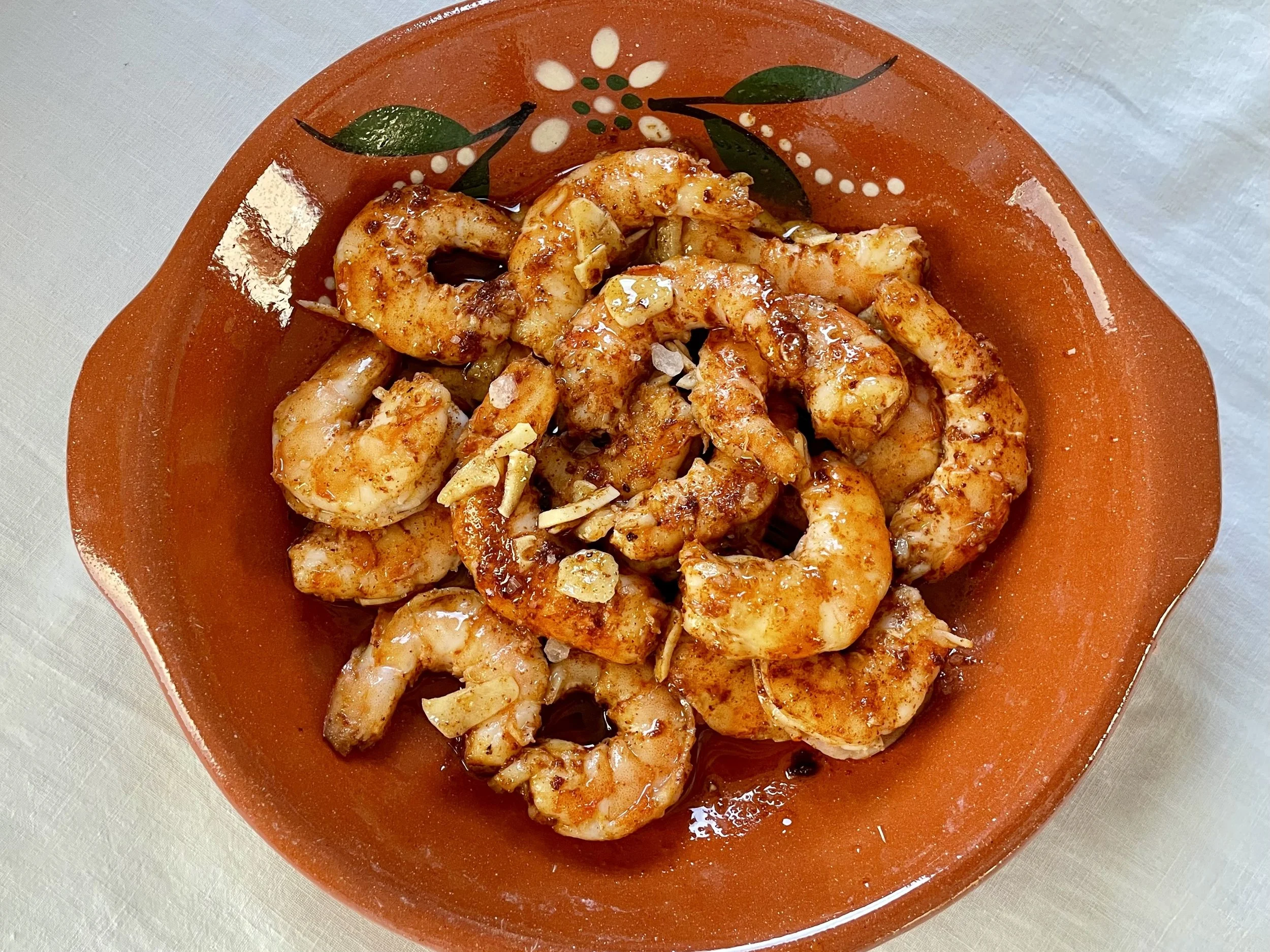 Fried garlic prawns served in a rustic Portuguese bowl
