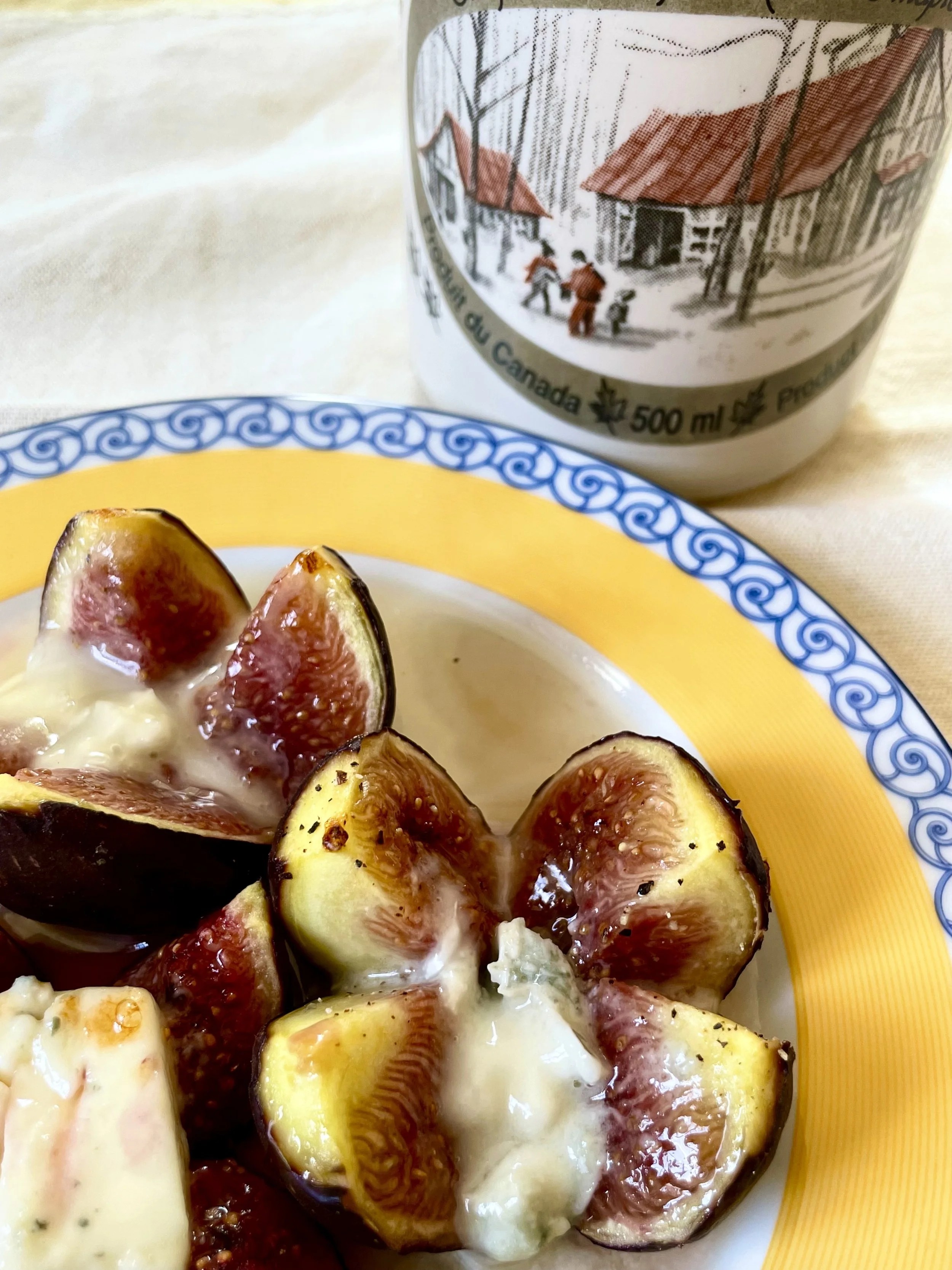 Figs, cheese and maple syrup bottle