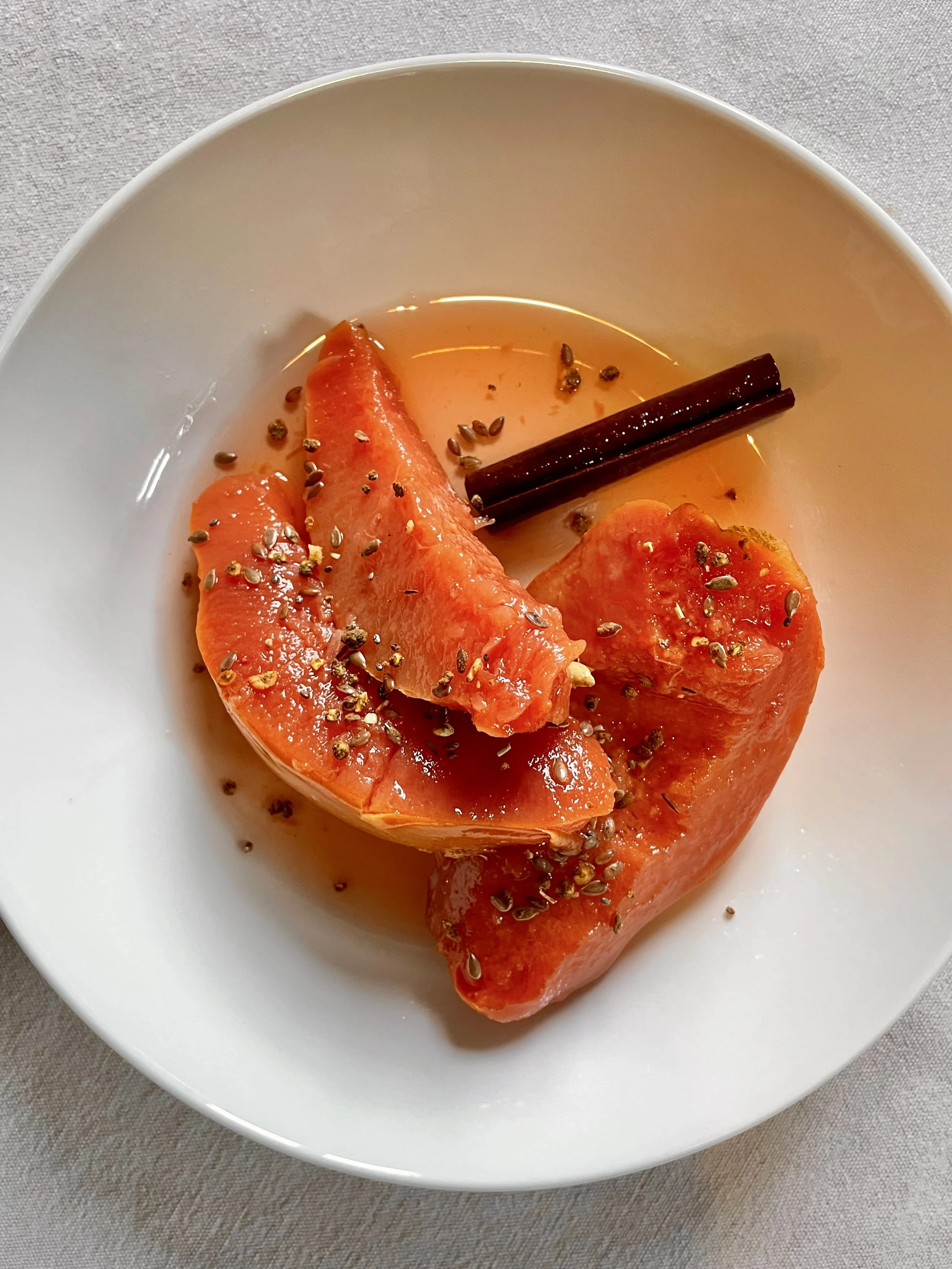 Poached quinces on a white bowl