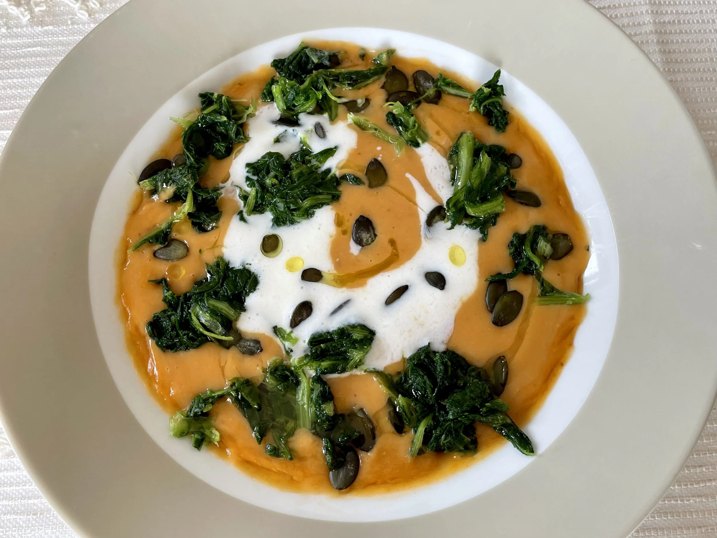 Beans and Tomato Soup garnished with turnip greens and kefir
