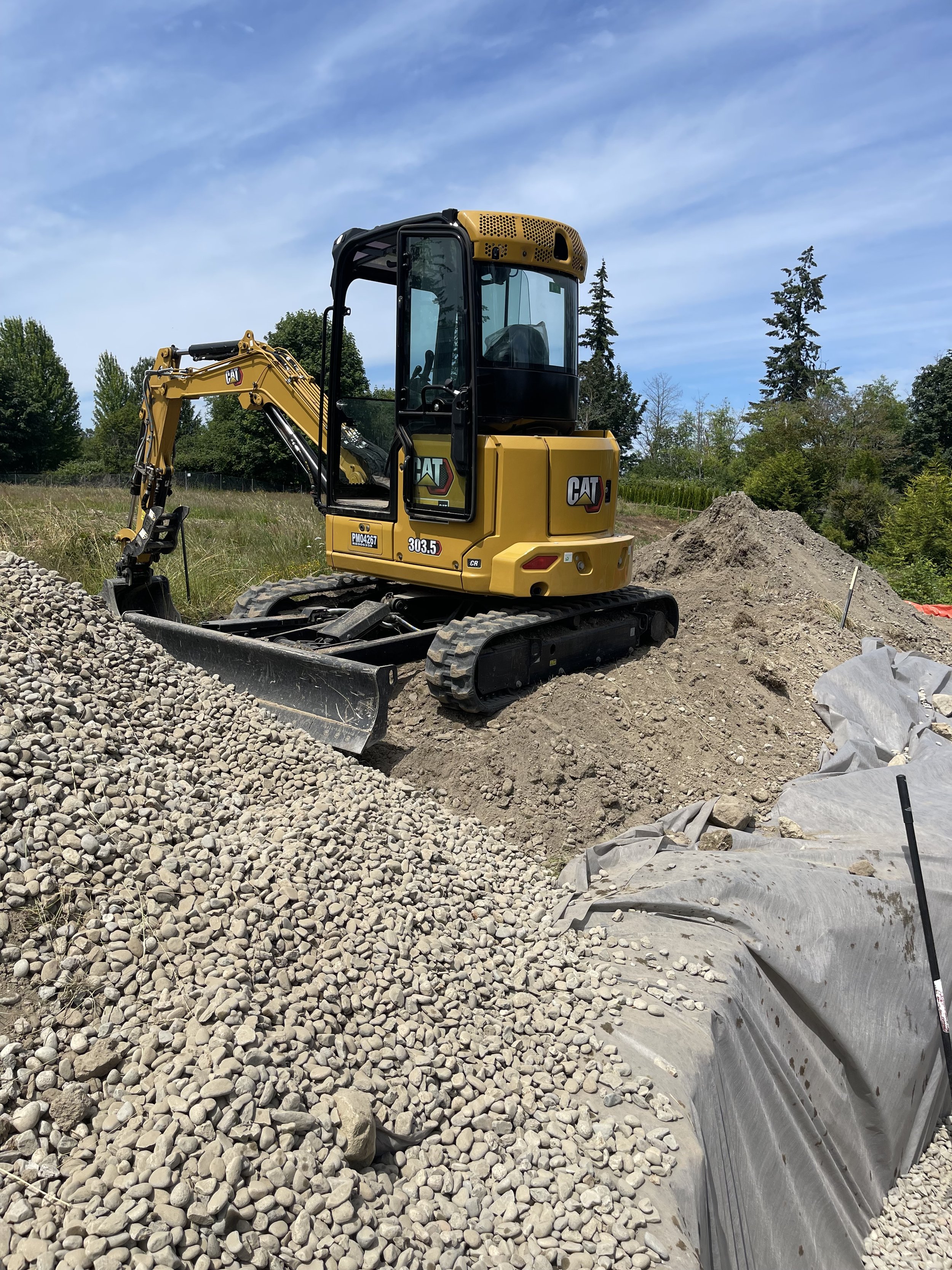 Tolt Enterprises CAT 303.5 mini excavator performing site work near Goldendale, Washington