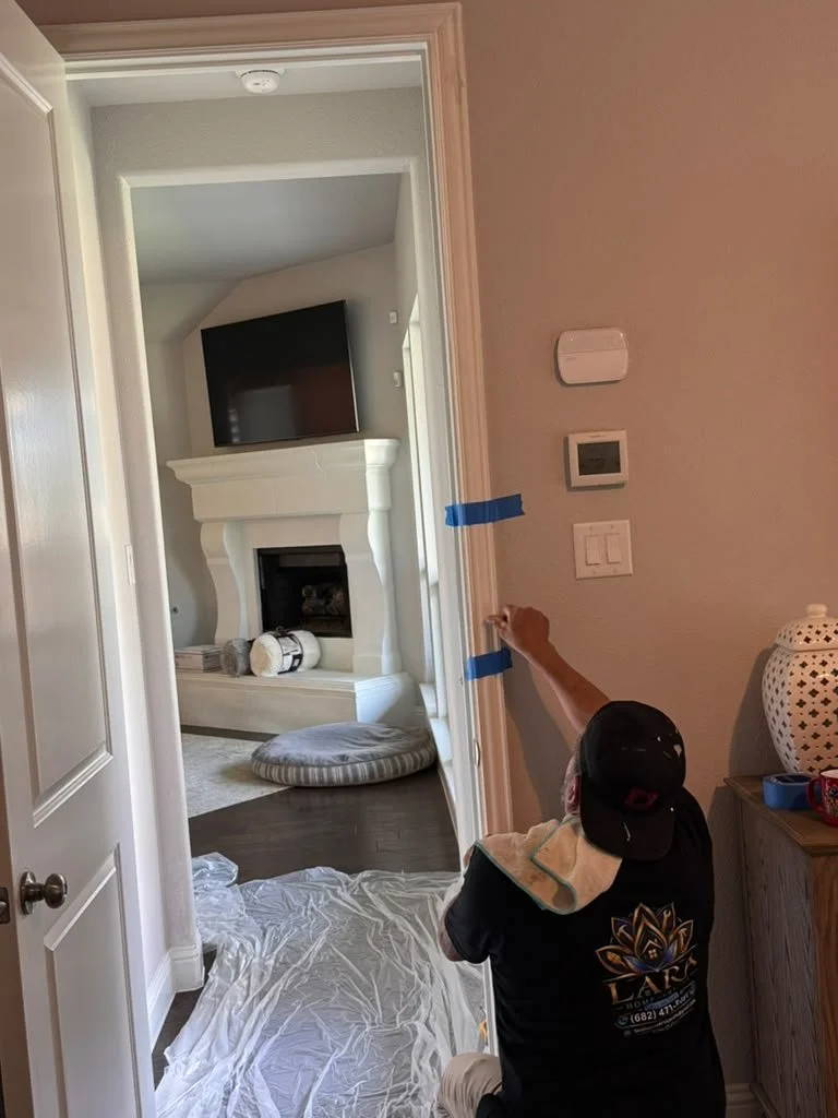 Lara Home & Commercial Services technician repairing interior door trim and finishing details in a home