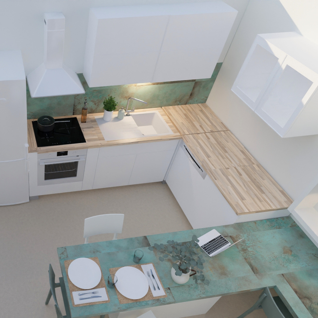 Vista aérea de una cocina moderna y minimalista con encimeras de madera, electrodomésticos blancos, y una mesa de comedor con platos, cubiertos, y una laptop.