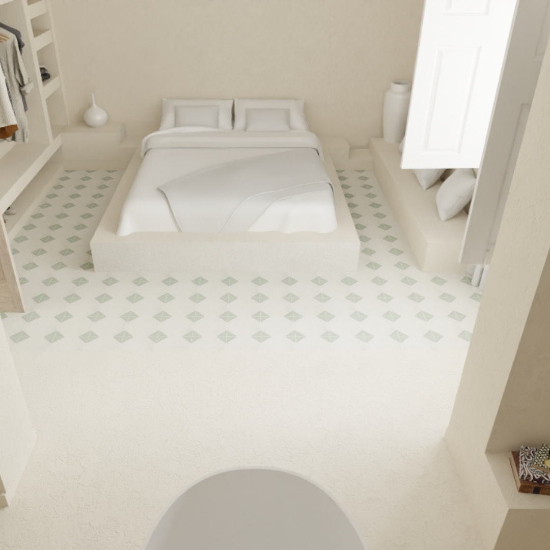 Habitación blanca con cama grande, dos almohadas, y decoración minimalista.