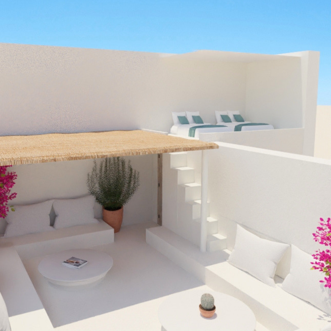 Espacio exterior con camas y áreas de descanso de estilo mediterráneo, paredes blancas, plantas en macetas, y un cielo azul claro.
