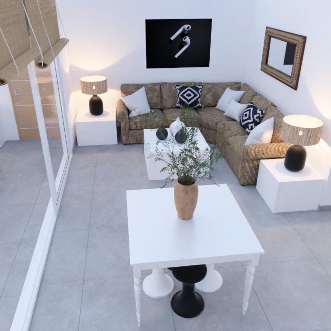 Sala de estar moderna con sofá en esquina, mesa de centro blanca, lámparas en las mesitas laterales, una mesa con un jarrón con plantas, cuadro de auriculares en la pared y un espejo decorativo