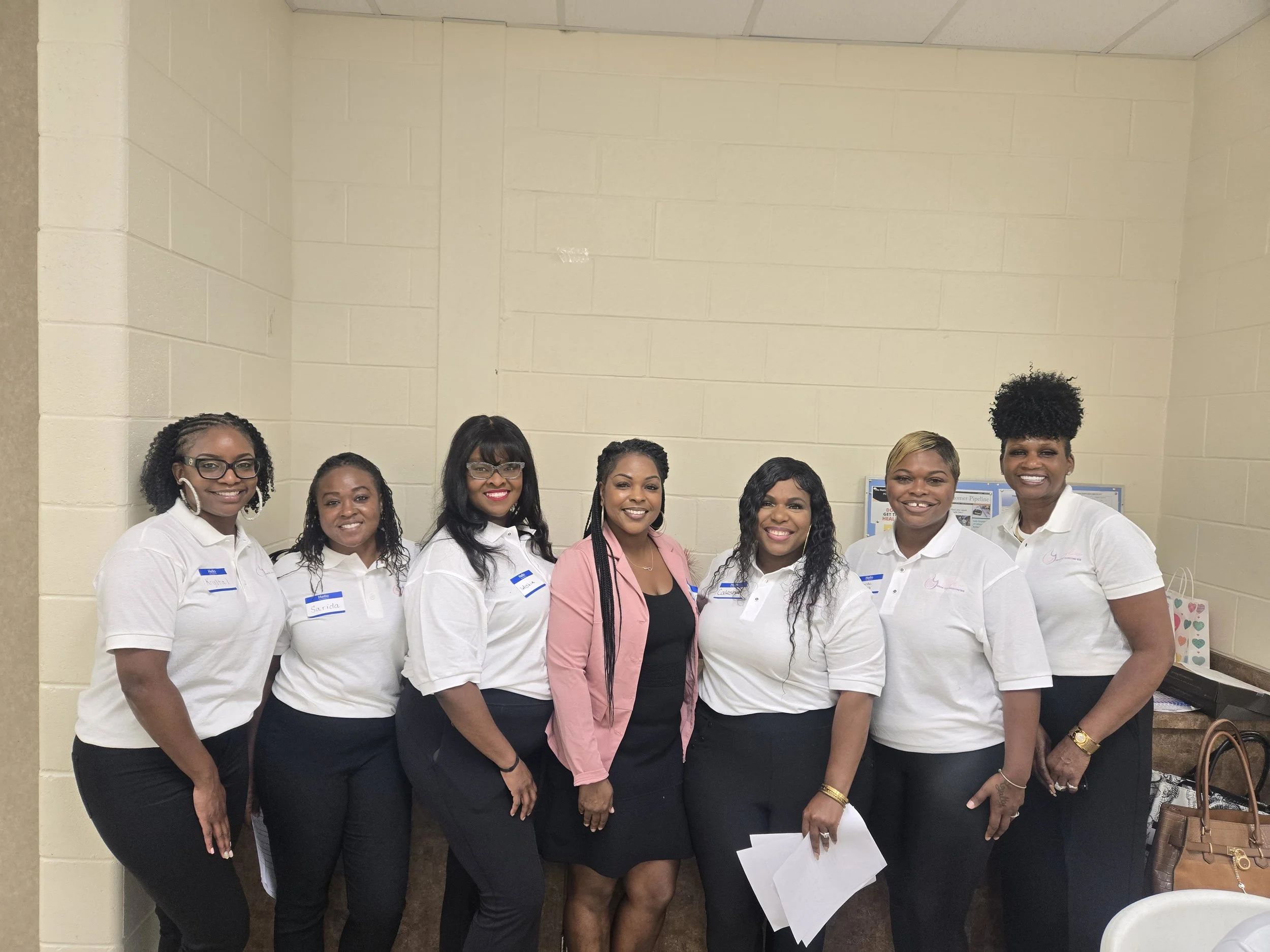 “GLOW Leadership & Development team members gathered together at a community event