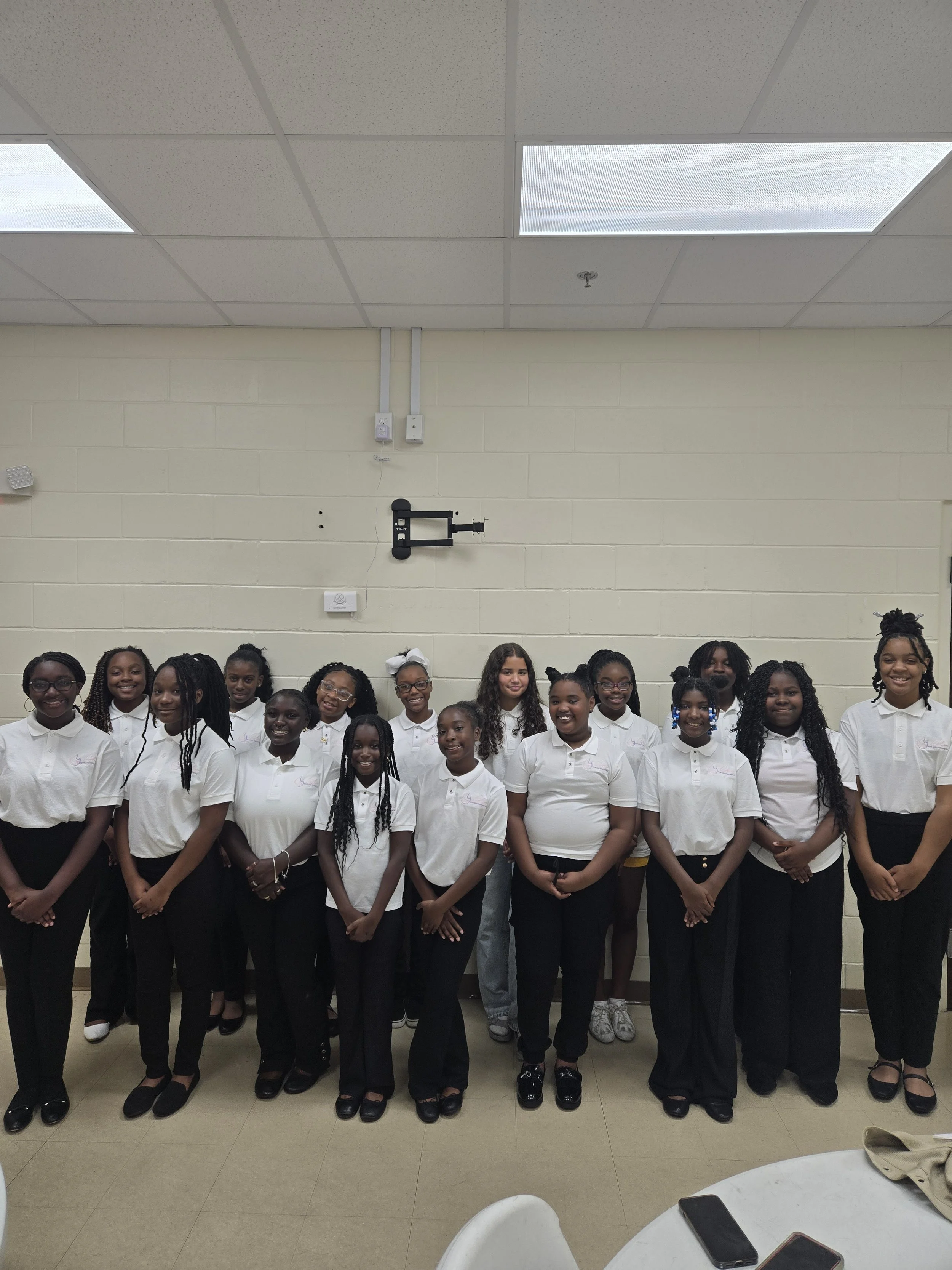 “GLOW girls standing together during a program event.”