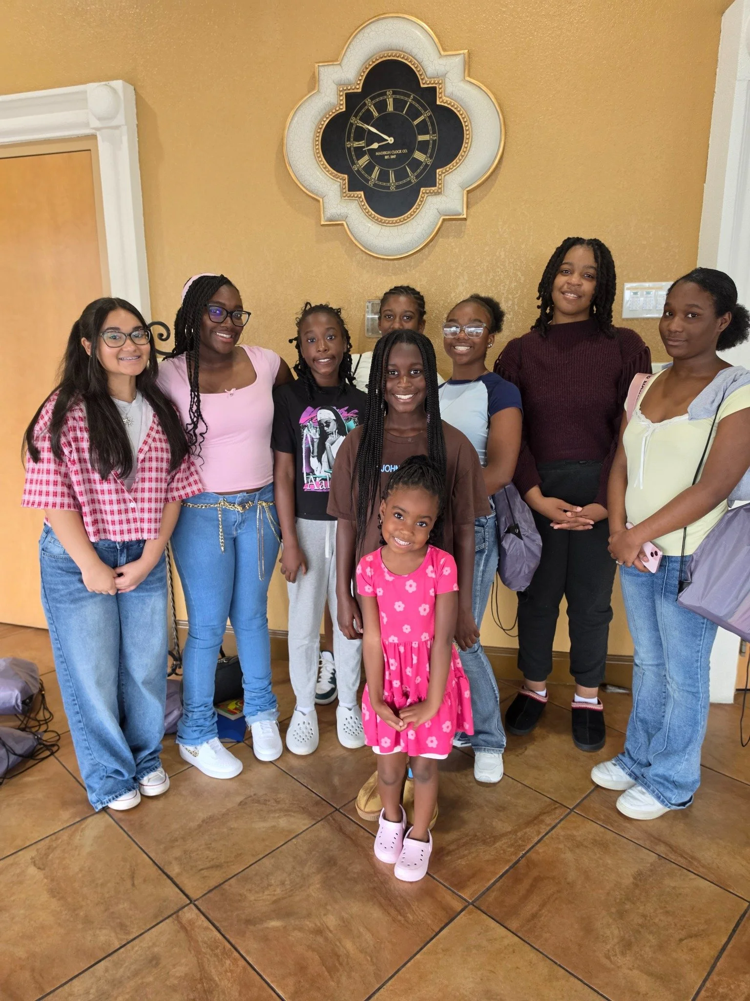 GLOW girls smiling together — GLOW looks good on her.