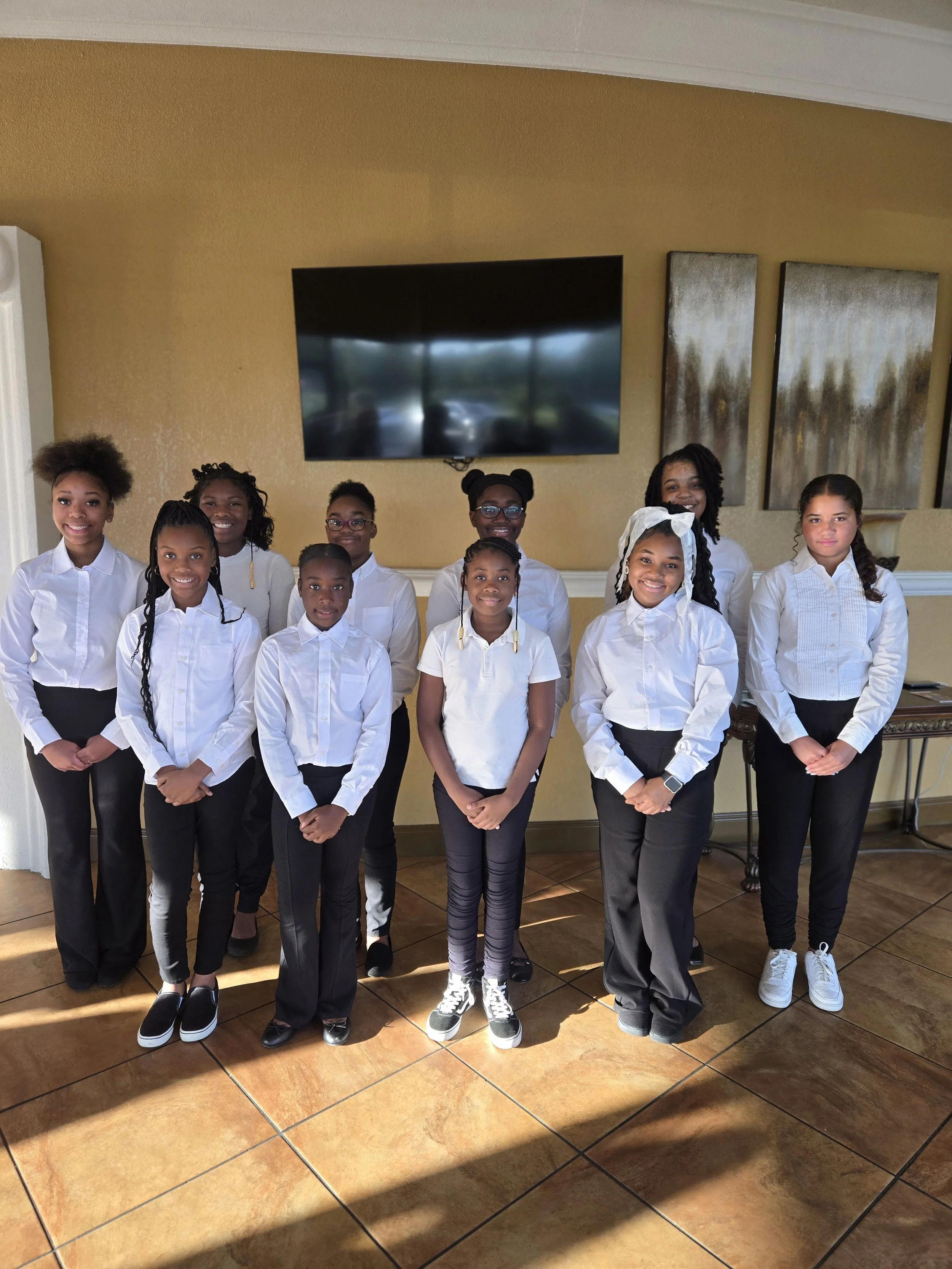 “GLOW girls standing together during a leadership program activity.”