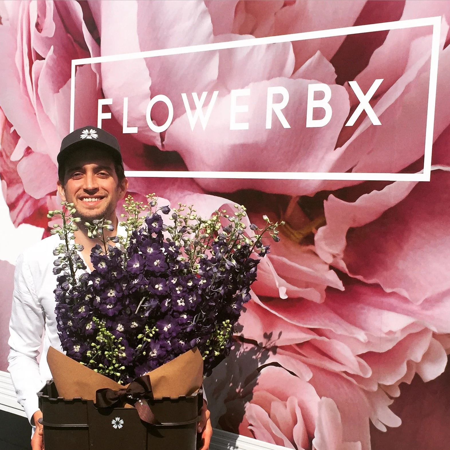 Photograph of FLOWERBX co-founder Adam Wilkie in front of the first FLOWERBX delivery van.