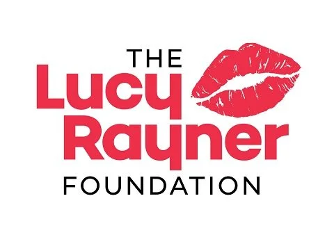Logo of The Lucy Rayner Foundation with red lips graphic.
