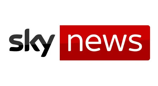 Sky News logo with black and white text on the left and a red rectangular background with white text on the right.