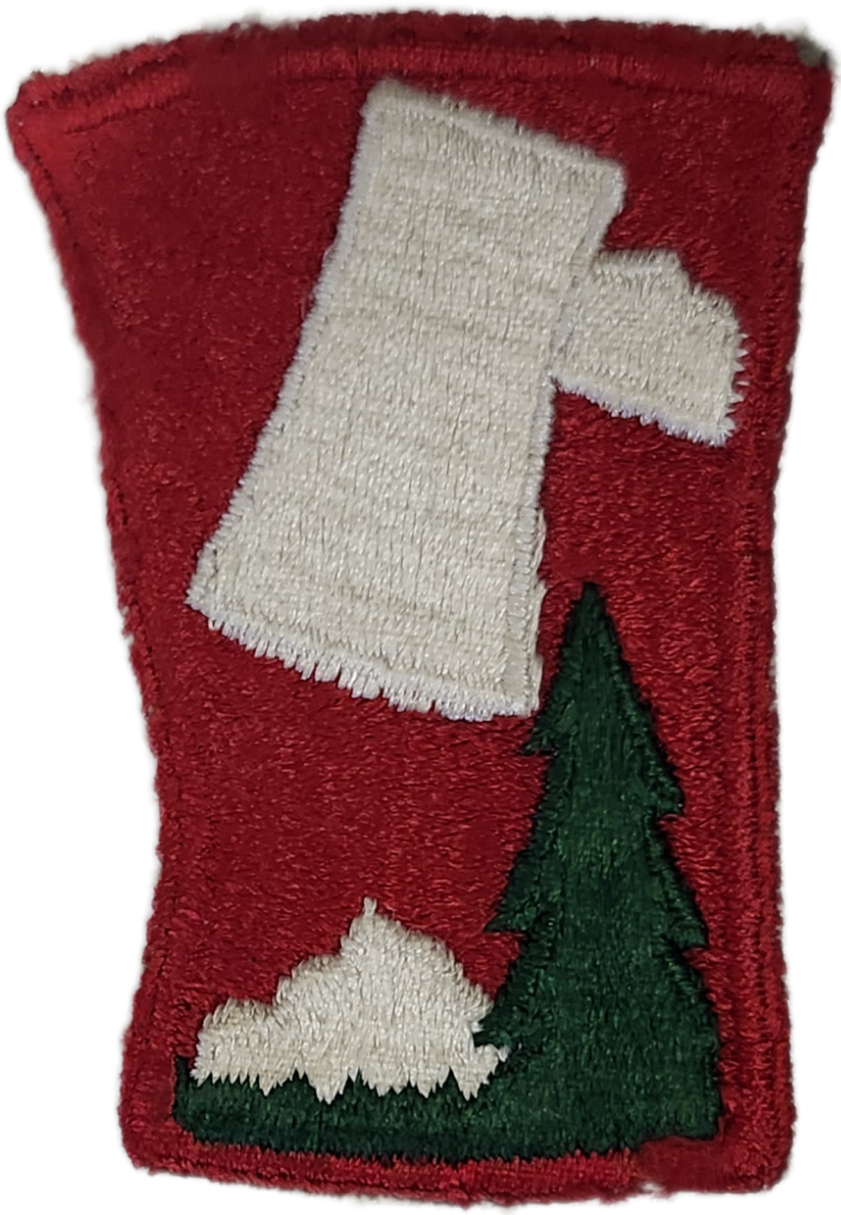 Embroidery patch with a red background, featuring a white stocking hanging on a Christmas tree, and a green Christmas tree below.