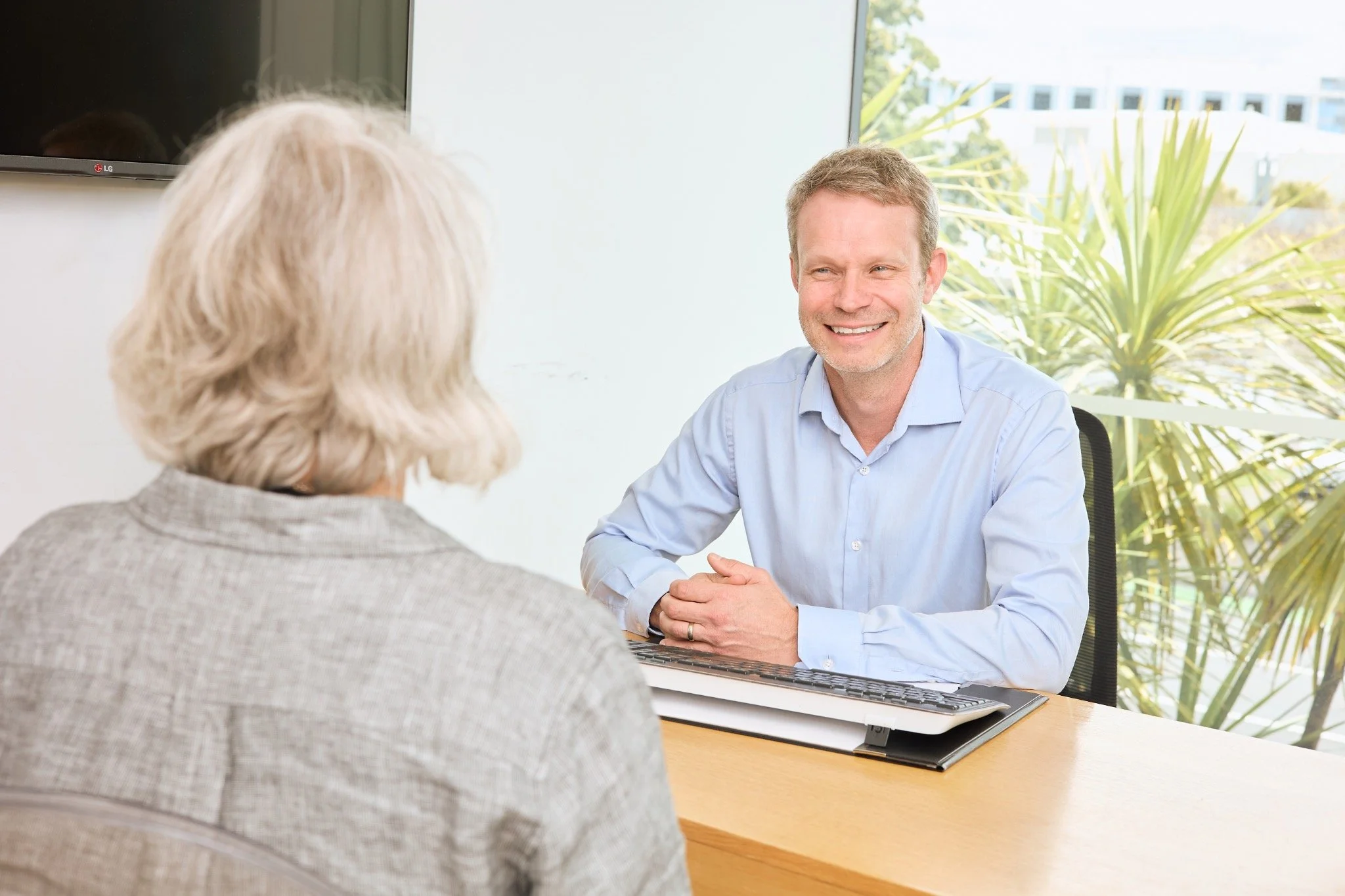Brad Chittenden discussing gynaecological care during a consultation
