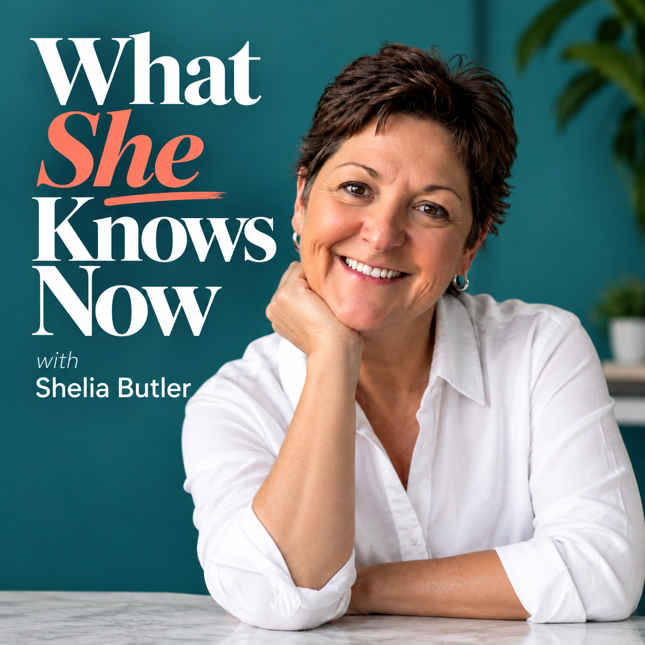 Cover image of the podcast 'What She Knows Now' featuring Shelia Butler, with a woman smiling, wearing a white shirt, resting her chin on her hand, in a room with a teal background and plants.