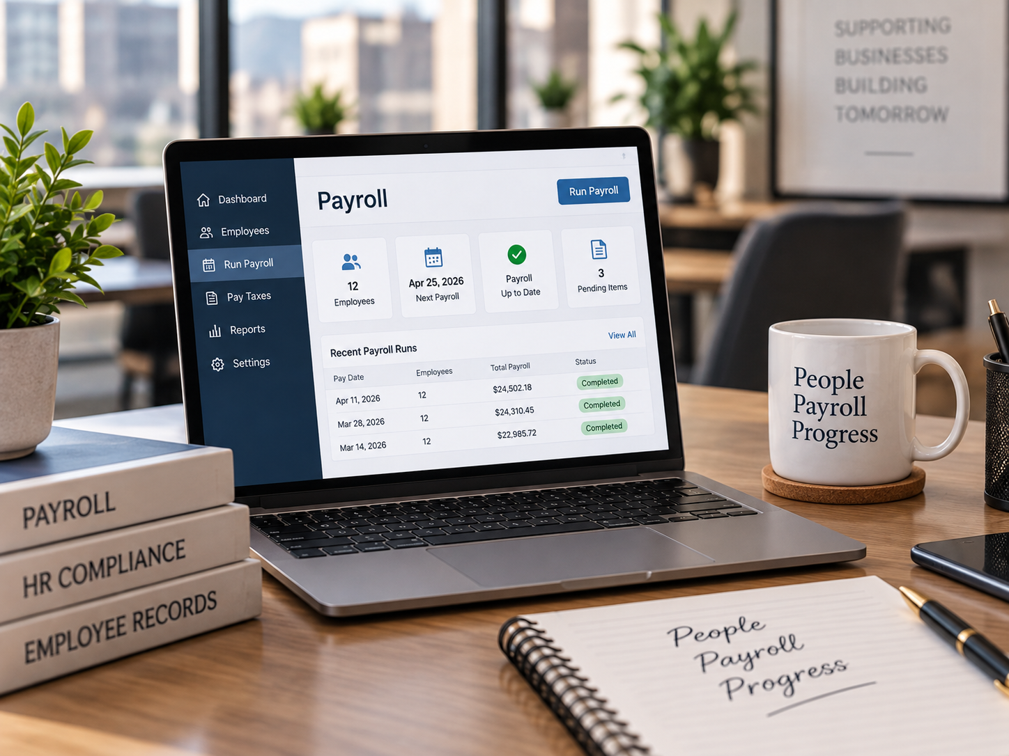 Laptop on a desk showing payroll software with recent payroll runs and employee details. Desk also has a mug with 'People Payroll Progress' written on it, a notebook labeled 'People Payroll Progress', and a stack of books titled 'Payroll,' 'HR Compliance,' and 'Employee Records'. There are plants and windows in the background.