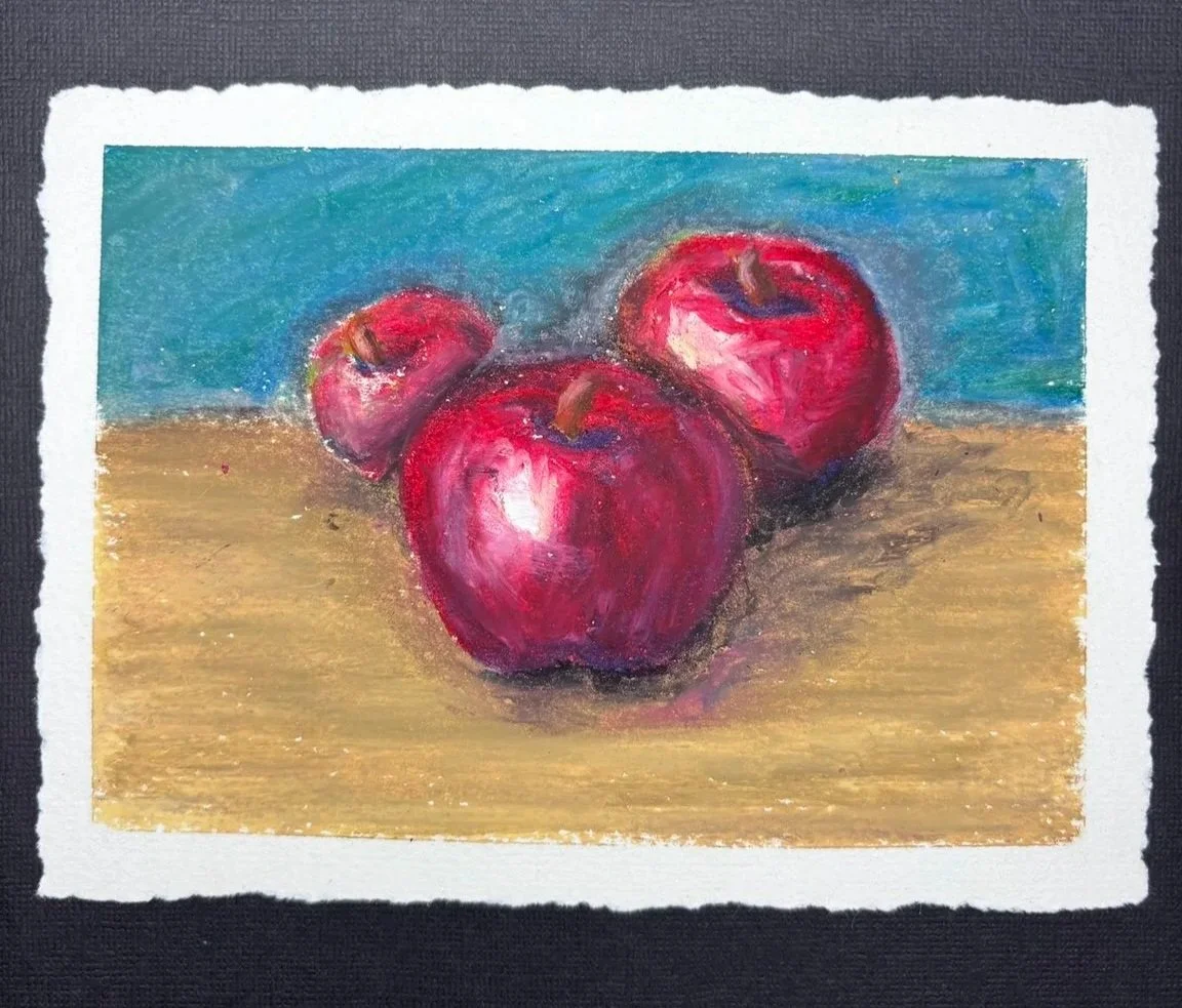 Apples in Red — Three red apples in a traditional still life. Practice highlights, form shadows, and cast shadows. Approximately 90–105 minutes.