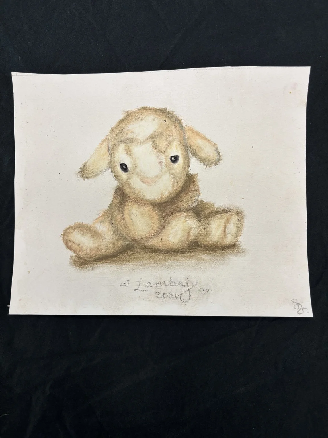 Handmade watercolor drawing of a cute baby lamb sitting with a bright smile, with a handwritten note that reads 'a Lamby 2023' at the bottom.