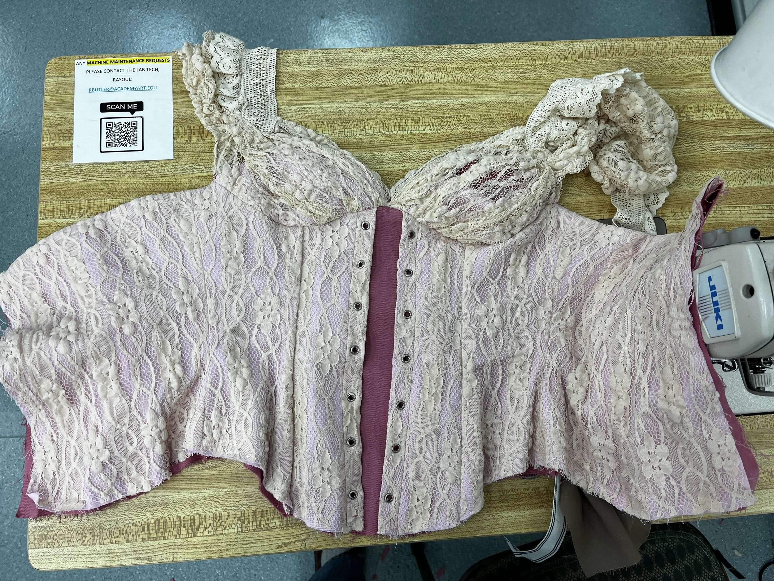 Corseted zip up dress, with decorative front lace up and draped skirt. Measured and sewn to my measurements. Designed, flat patterned, and constructed in 2024.