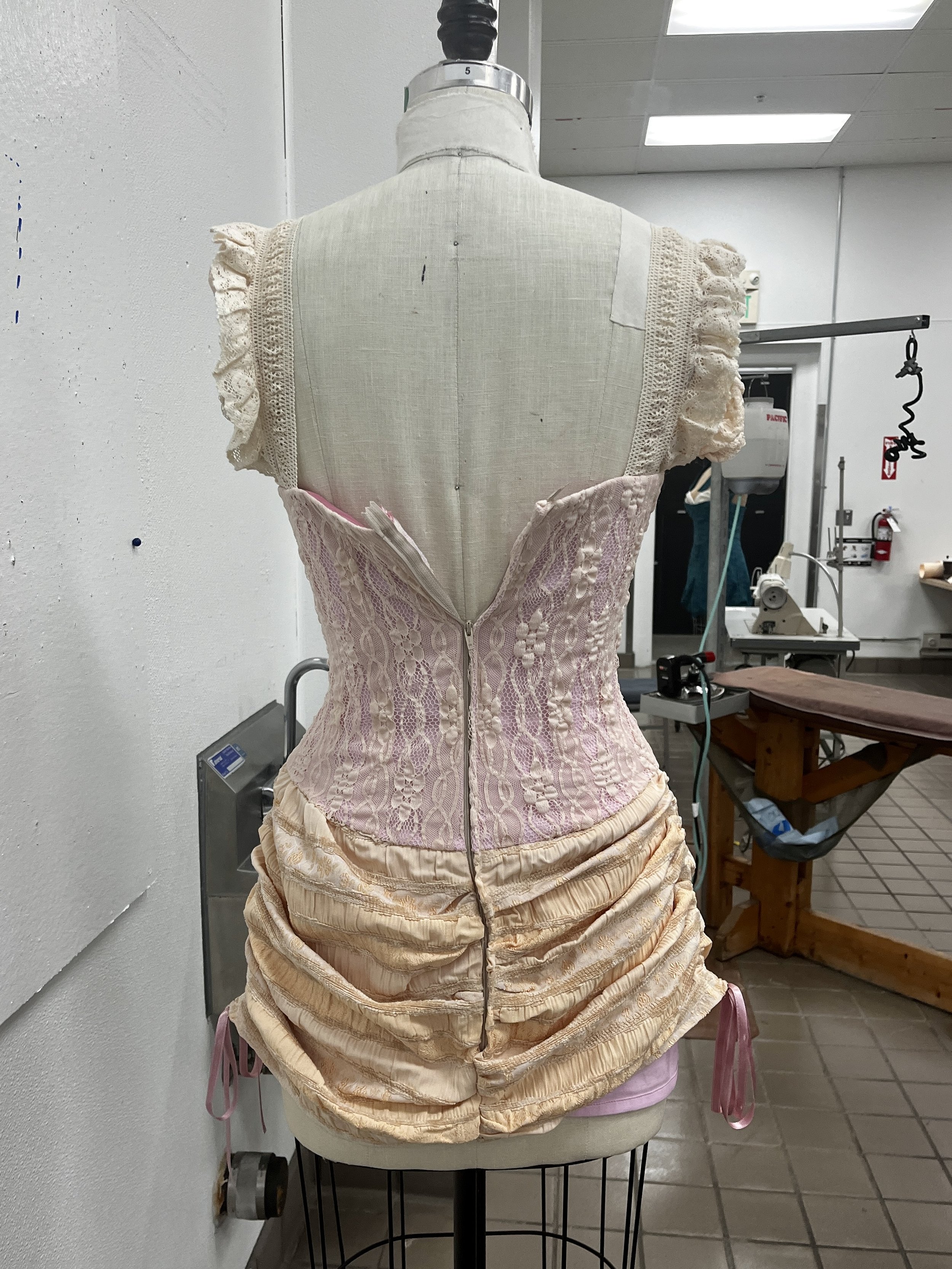 Corseted zip up dress, with decorative front lace up and draped skirt. Measured and sewn to my measurements. Designed, flat patterned, and constructed in 2024.