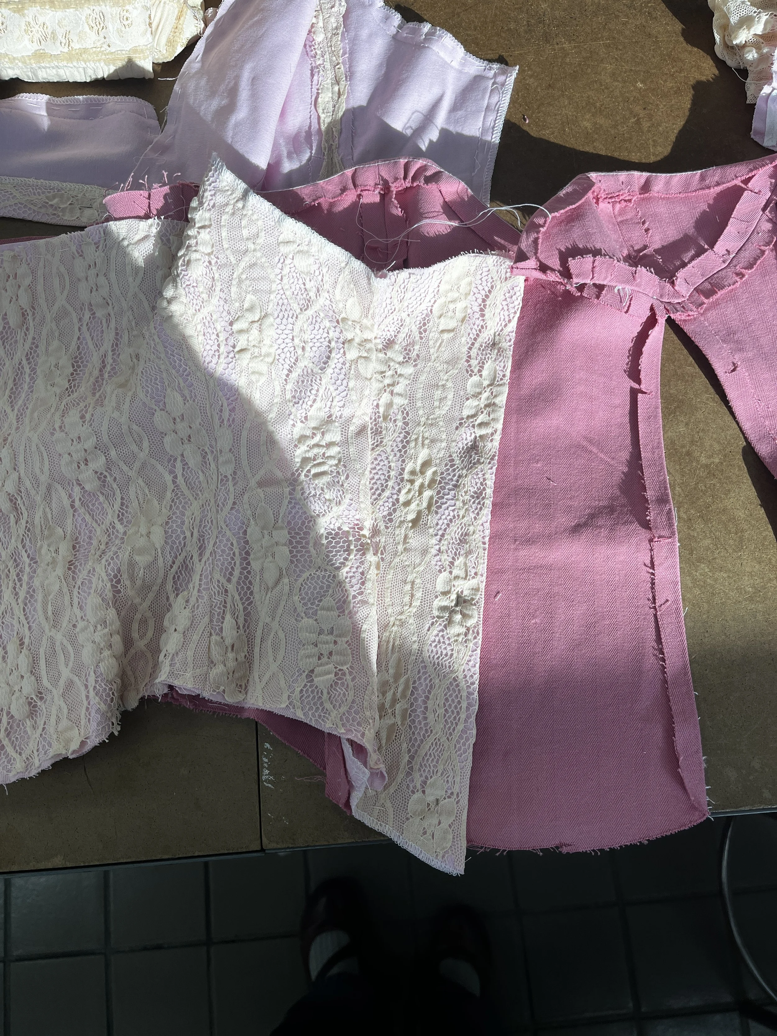 Corseted zip up dress, with decorative front lace up and draped skirt. Measured and sewn to my measurements. Designed, flat patterned, and constructed in 2024.