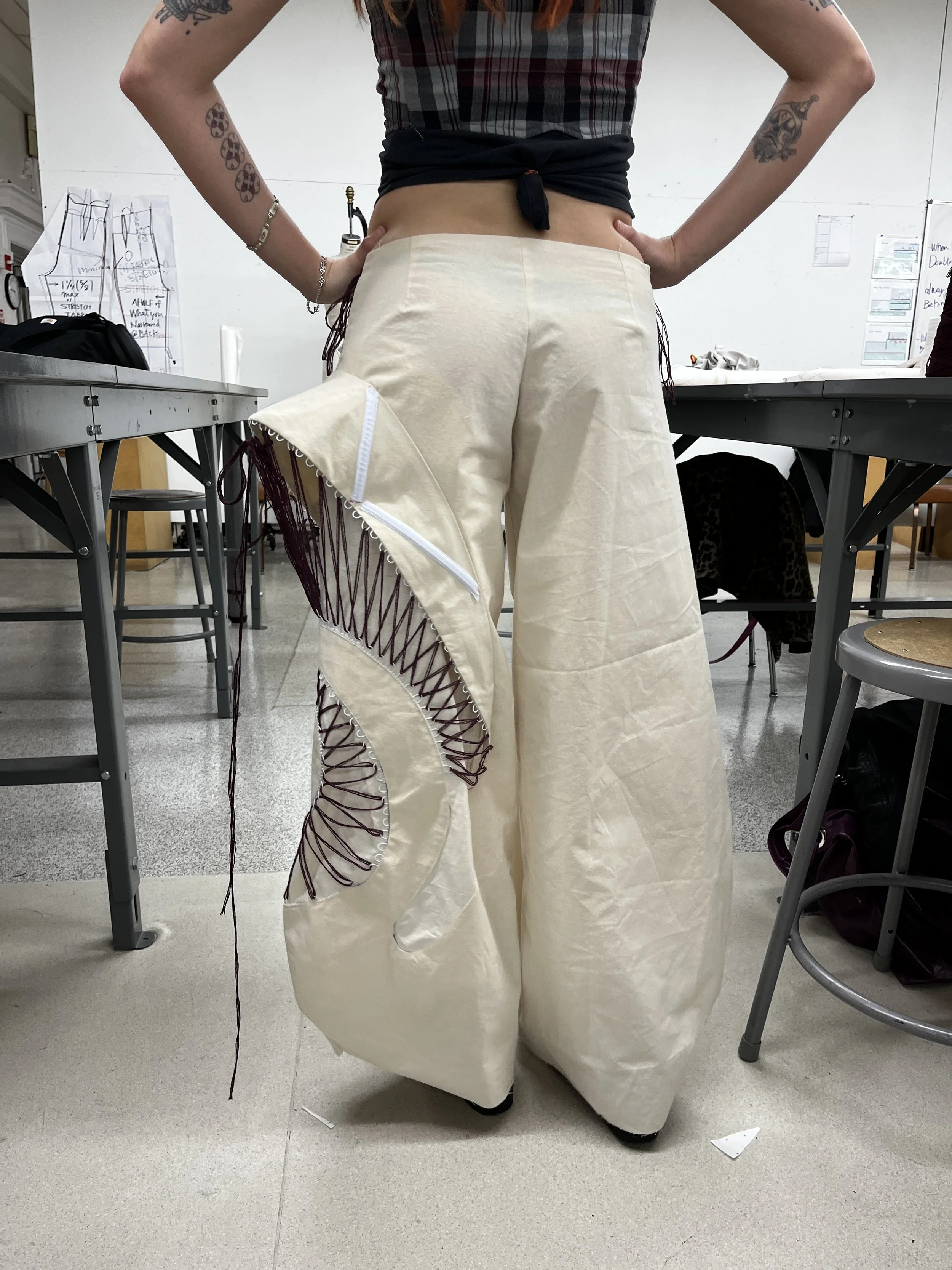 Pants Design Project:
Cotton twill spiral cutout pants with boned hood, lace up, and curved welt pockets. Designed, flat patterned, and constructed in 2025.