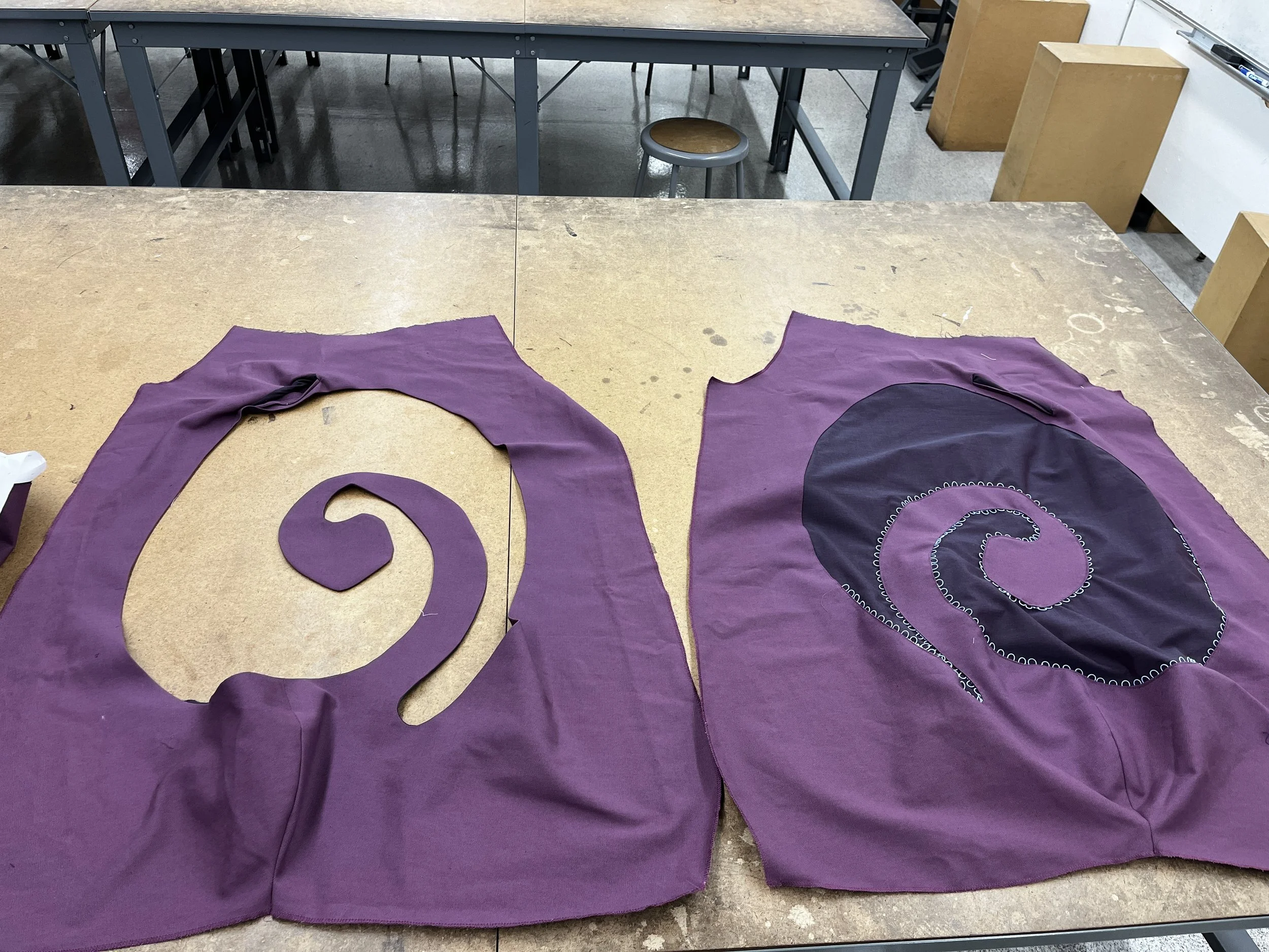 Pants Design Project:
Cotton twill spiral cutout pants with boned hood, lace up, and curved welt pockets. Designed, flat patterned, and constructed in 2025.
