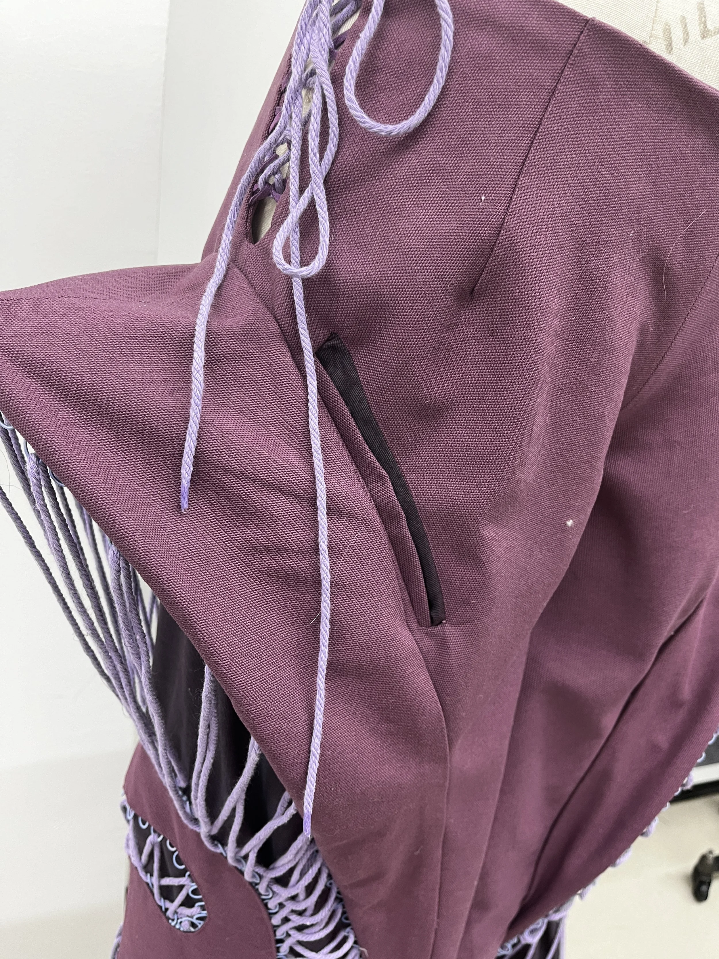 Pants Design Project:
Cotton twill spiral cutout pants with boned hood, lace up, and curved welt pockets. Designed, flat patterned, and constructed in 2025.