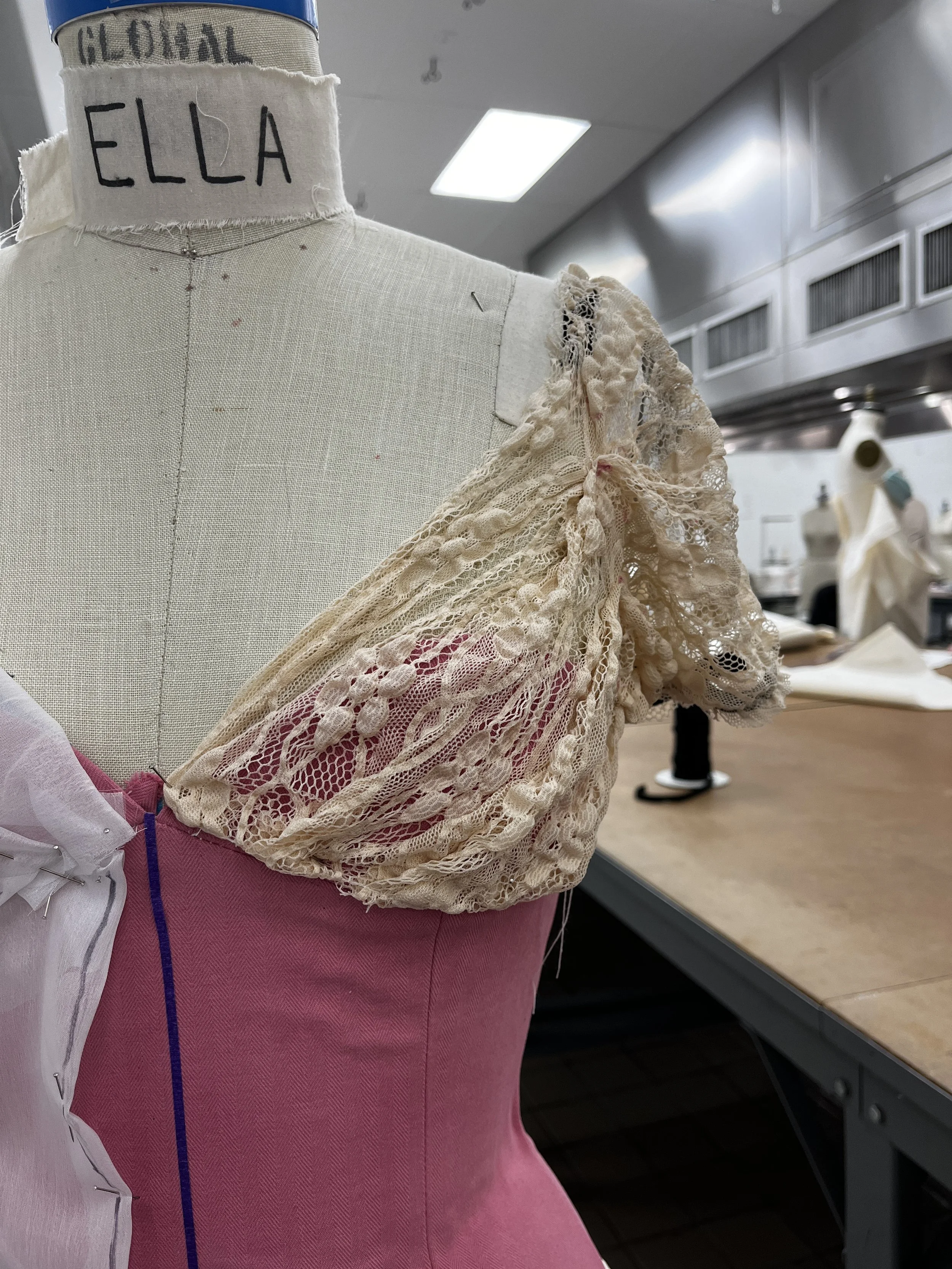 Corseted zip up dress, with decorative front lace up and draped skirt. Measured and sewn to my measurements. Designed, flat patterned, and constructed in 2024.