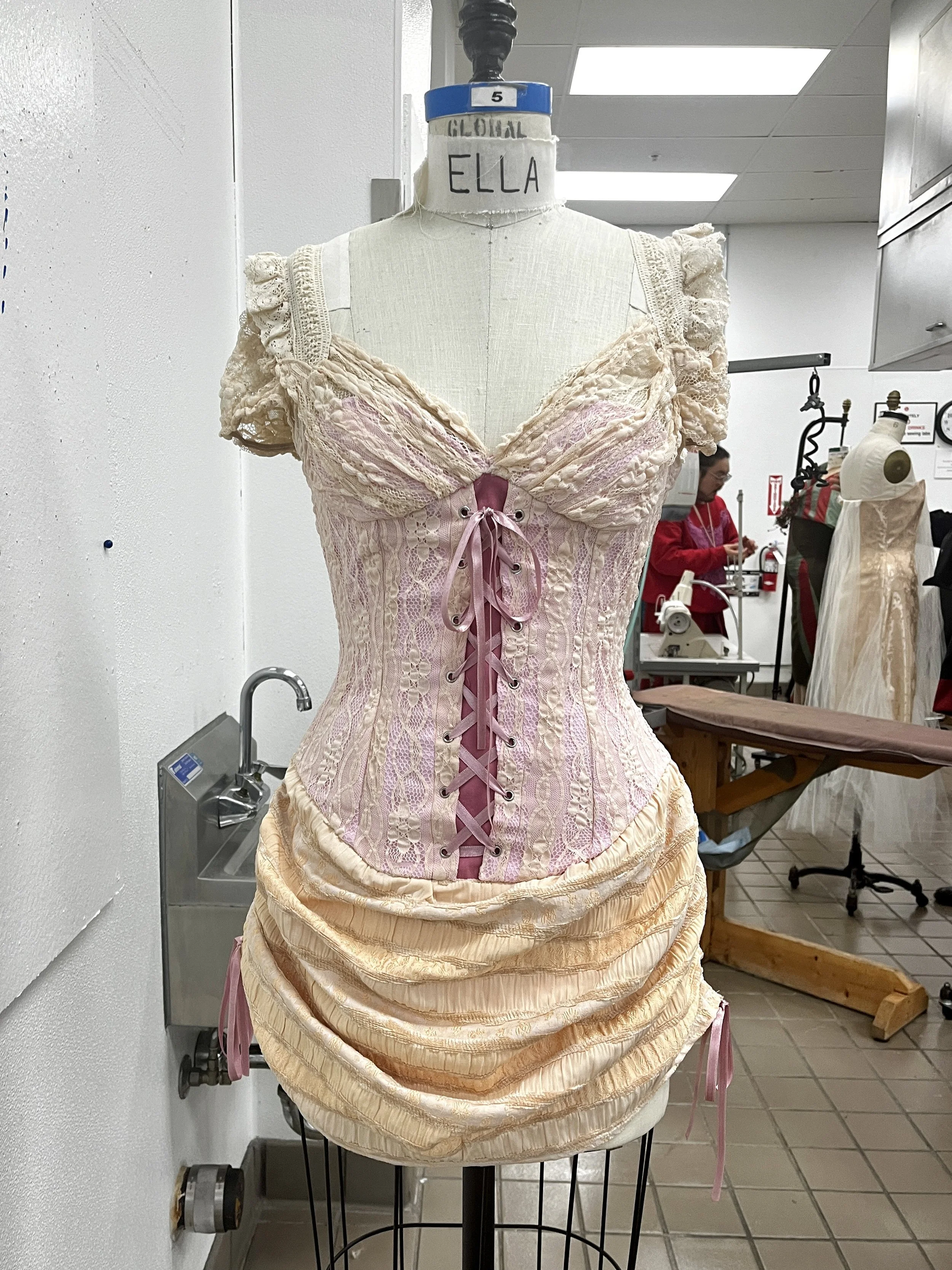 Corseted zip up dress, with decorative front lace up and draped skirt. Measured and sewn to my measurements. Designed, flat patterned, and constructed in 2024.