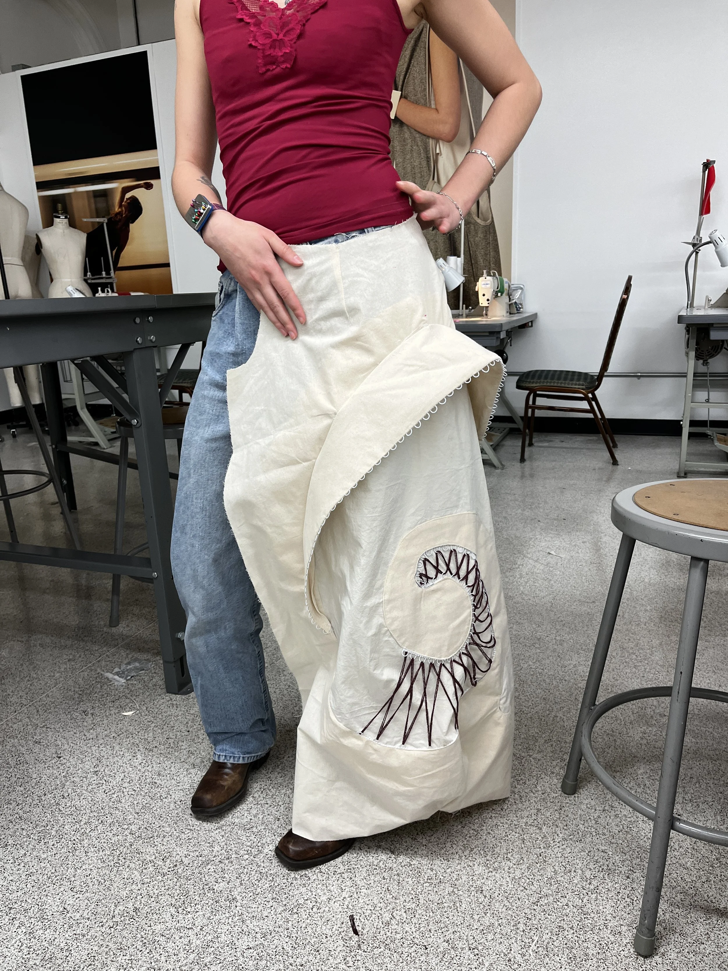 Pants Design Project:
Cotton twill spiral cutout pants with boned hood, lace up, and curved welt pockets. Designed, flat patterned, and constructed in 2025.